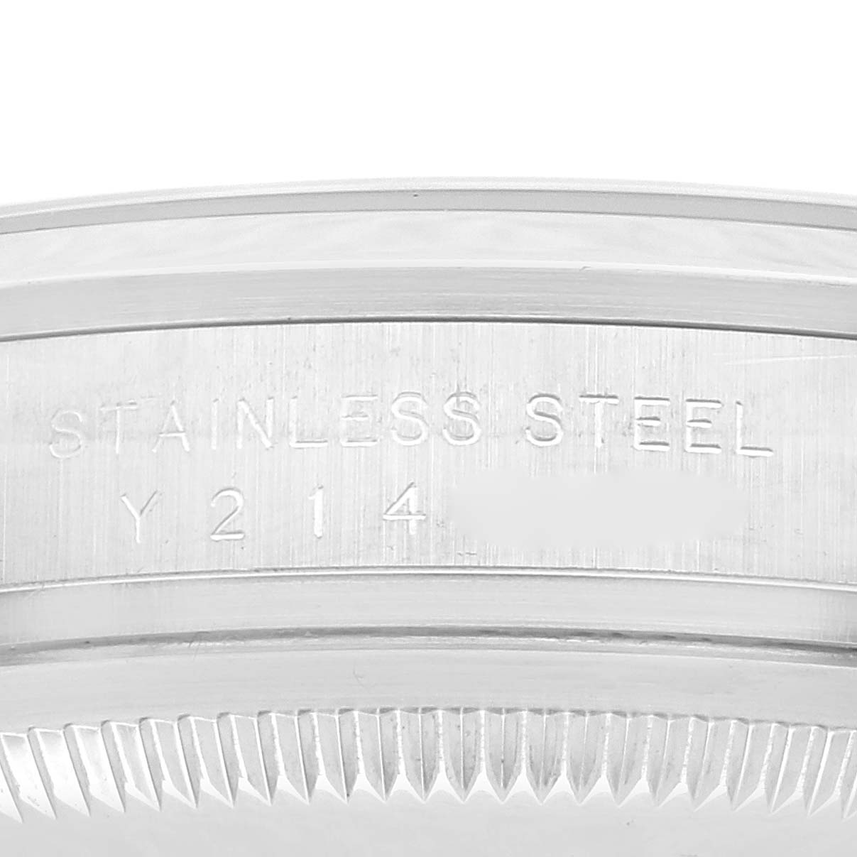 This is a close-up angle showing the engraved edge of the stainless steel casing of a Rolex Explorer 114270 Men
s Stainless Steel Black Dial 114270 Men
s Stainless Steel Black Dial model watch.