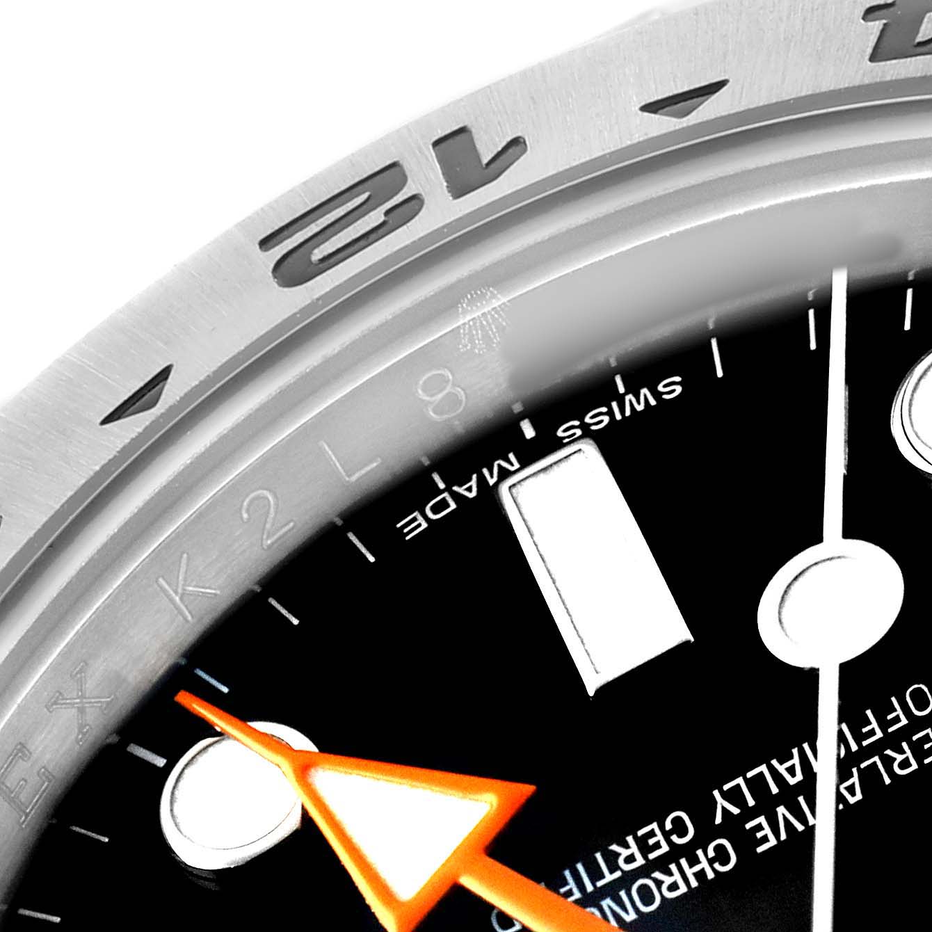 The image features a close-up of the Rolex Explorer 216570 Men's Stainless Steel Black Dial's bezel and minute hand at an angle, highlighting the "SWISS MADE" text.