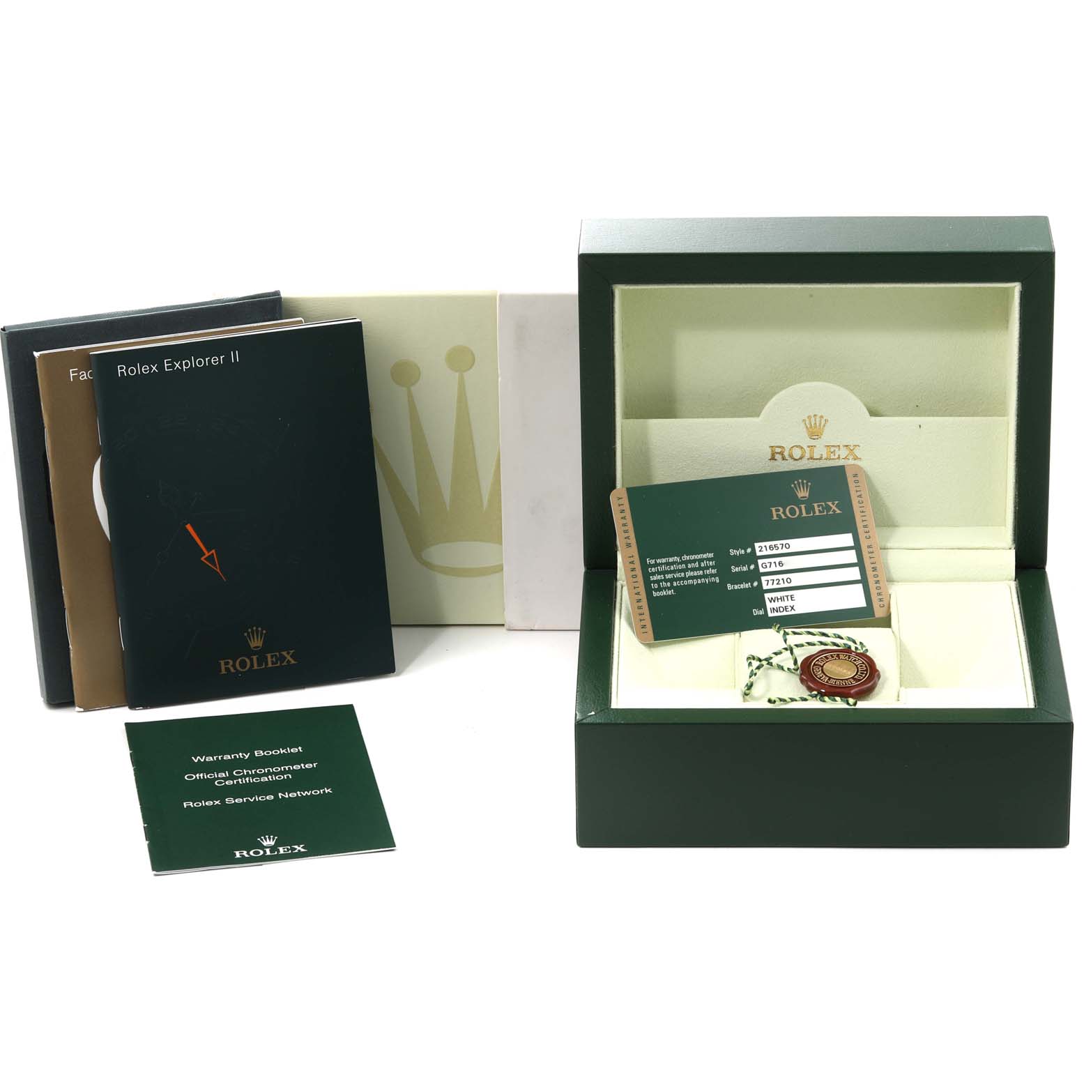 The image shows accessories for a Rolex Explorer 216570 Men
s Stainless Steel White Dial 216570 Men
s Stainless Steel White Dial II, including the box, warranty card, booklet, and hanging tag.