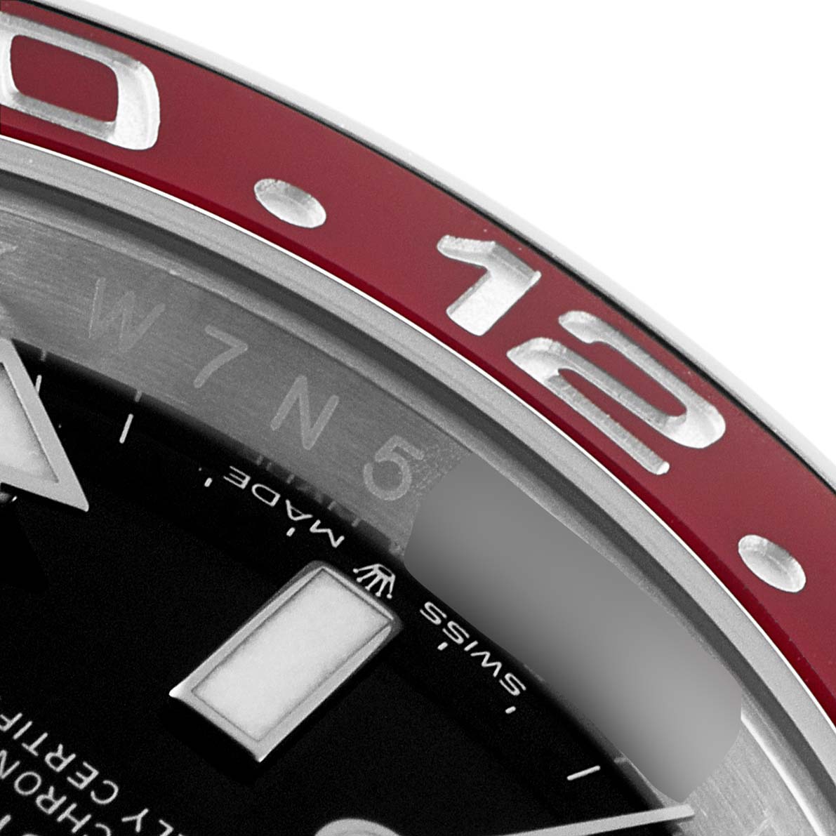 This close-up image of the Rolex GMT-Master 126710 Men
s Stainless Steel Black Dial 126710 Men
s Stainless Steel Black Dial watch features the red bezel, part of the dial, and the 24-hour markings.