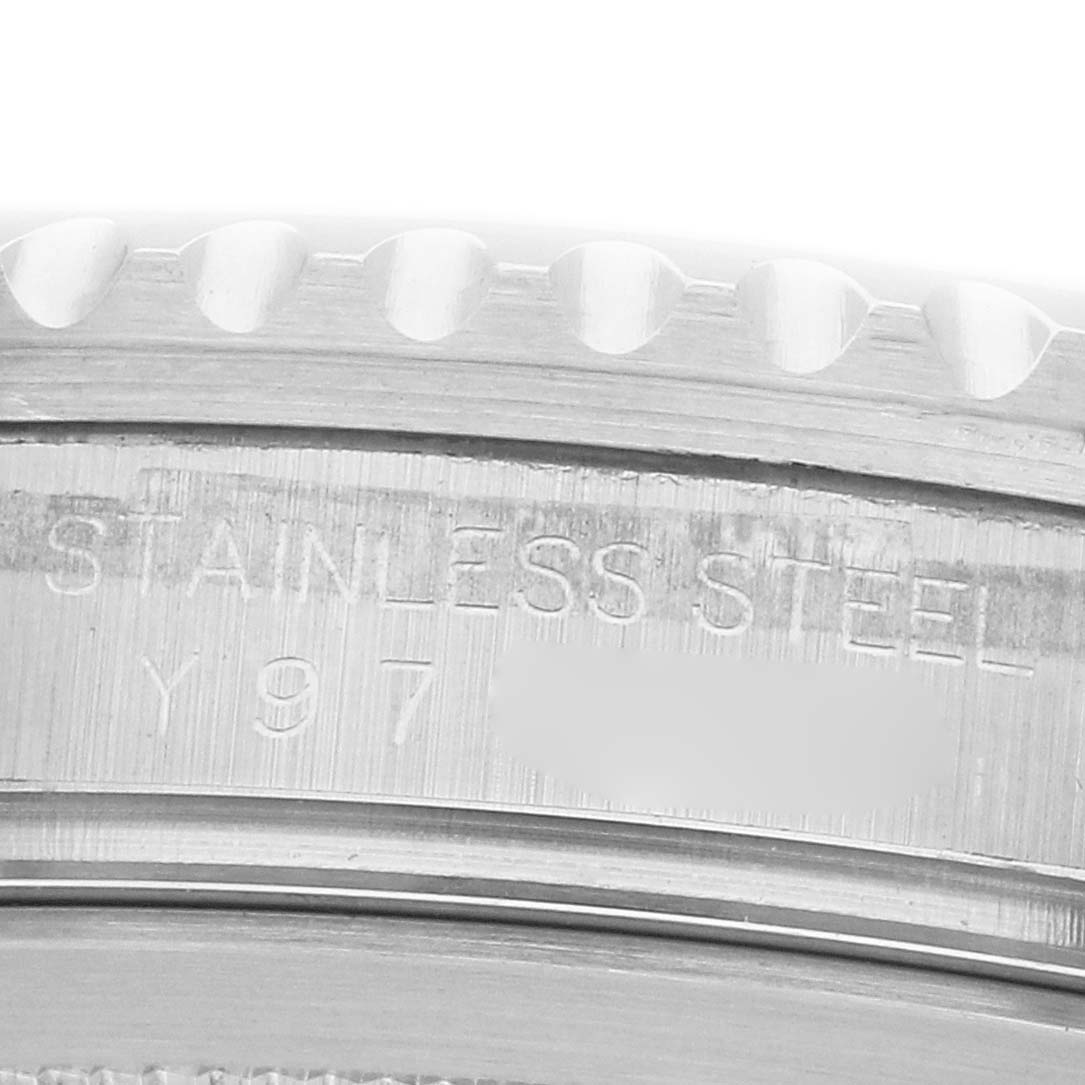 The image shows a close-up of the case back engraving on a Rolex GMT-Master 16710 Men's Stainless Steel Black Dial, highlighting "Stainless Steel" and part of the serial number.