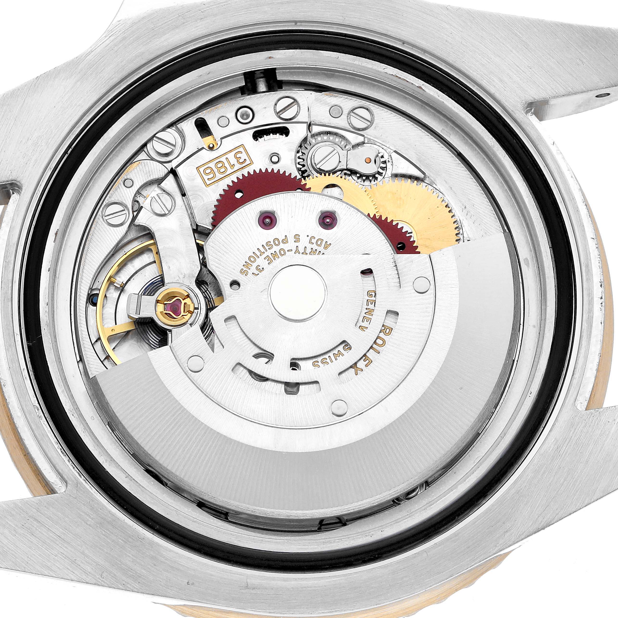 The image shows a close-up of the movement inside a Rolex GMT-Master 116713 Men's Steel and Gold (two tone) Black Dial watch, viewed from the back case.