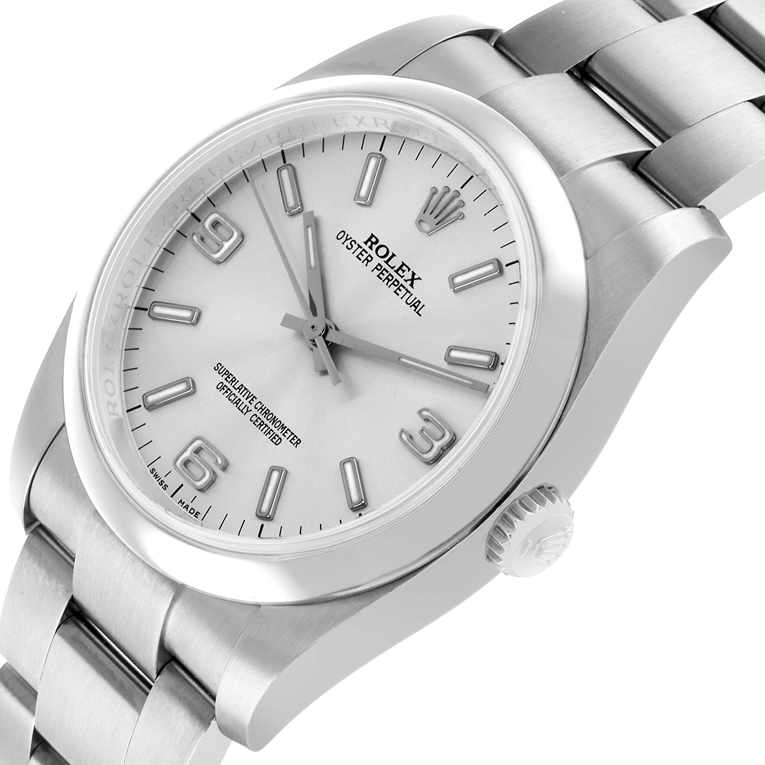 The Rolex Oyster Perpetual 116000 Men's Stainless Steel Silver Dial watch is shown at a tilted angle displaying the dial, crown, and part of the bracelet.