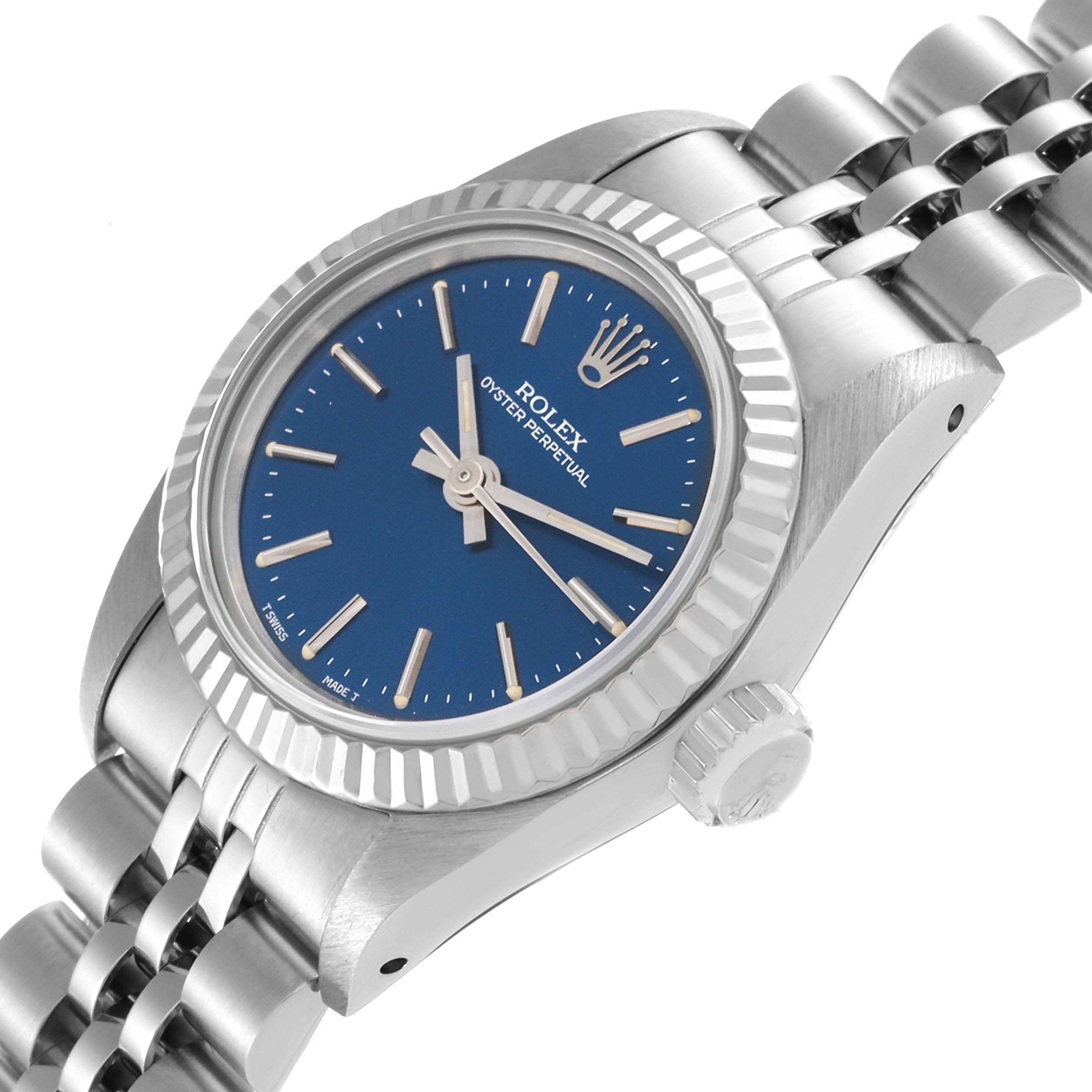 This Rolex Oyster Perpetual 67194 Women's Stainless Steel Blue Dial 67194 Women's Stainless Steel Blue Dial watch is shown at an angled close-up, highlighting its blue dial, bezel, and part of its bracelet.