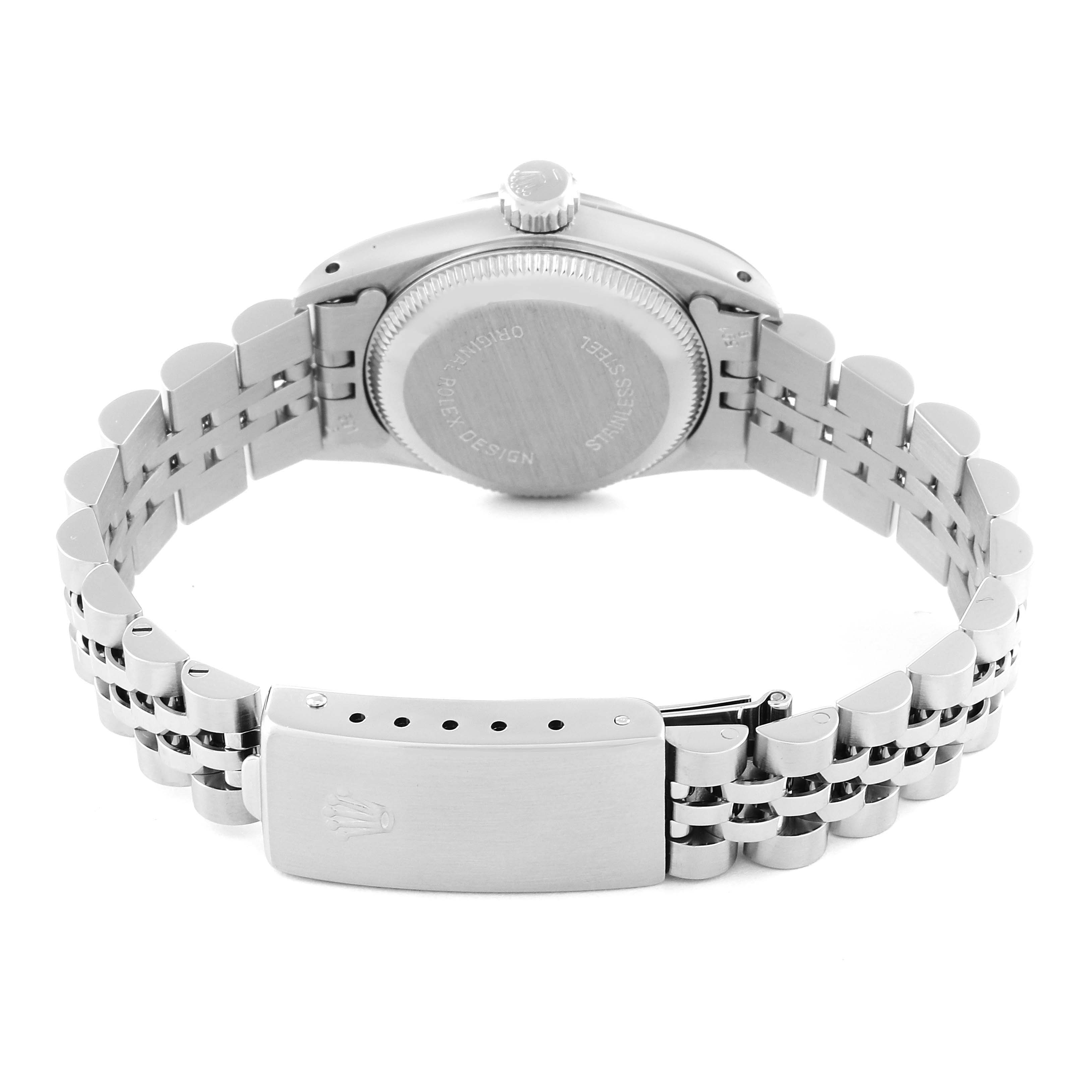 The image shows the backside of the Oyster Perpetual Rolex watch, including the case back and bracelet with a clasp.