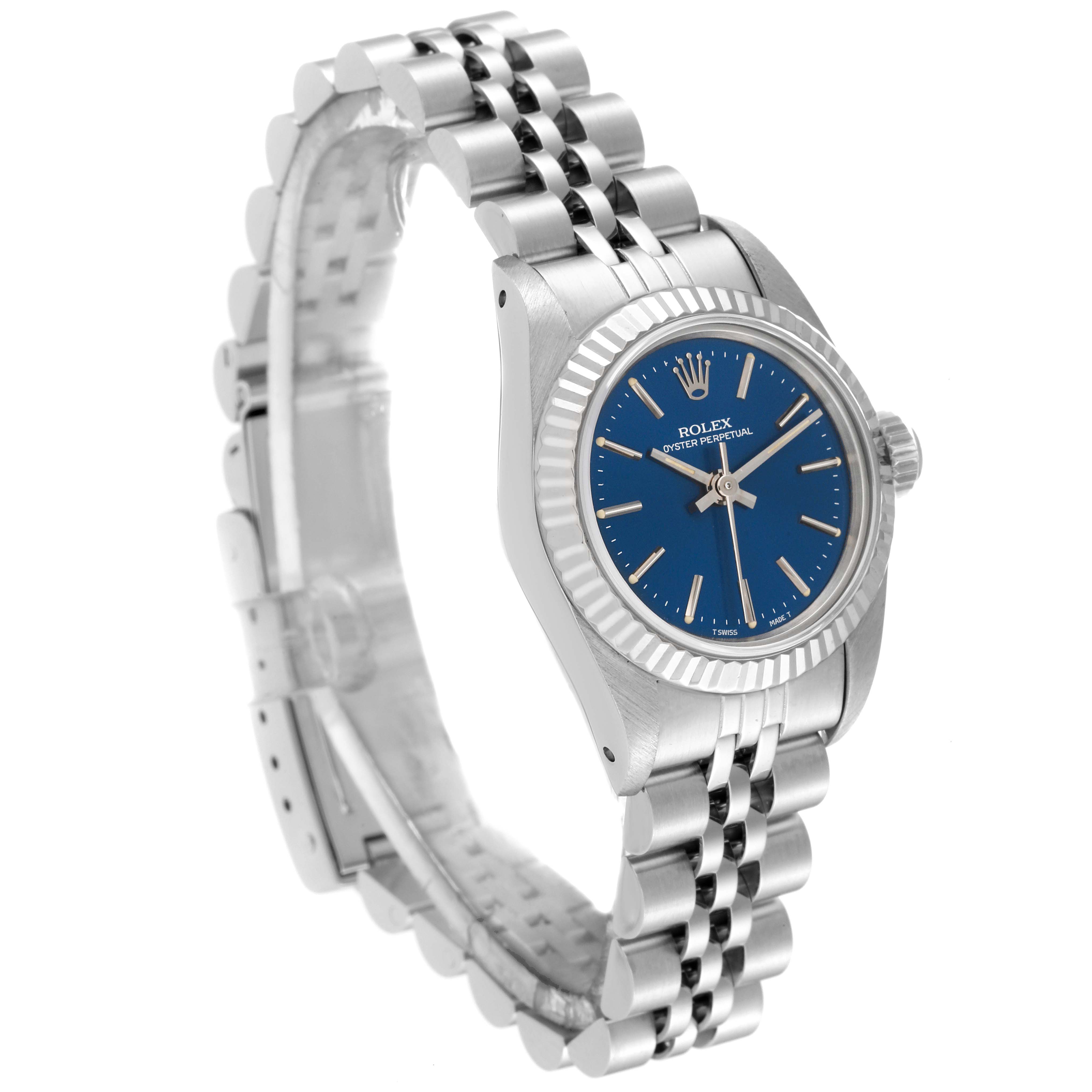This Rolex Oyster Perpetual 67194 Women's Stainless Steel Blue Dial 67194 Women's Stainless Steel Blue Dial watch is shown at an angled side view, highlighting its blue dial, fluted bezel, and Jubilee bracelet.