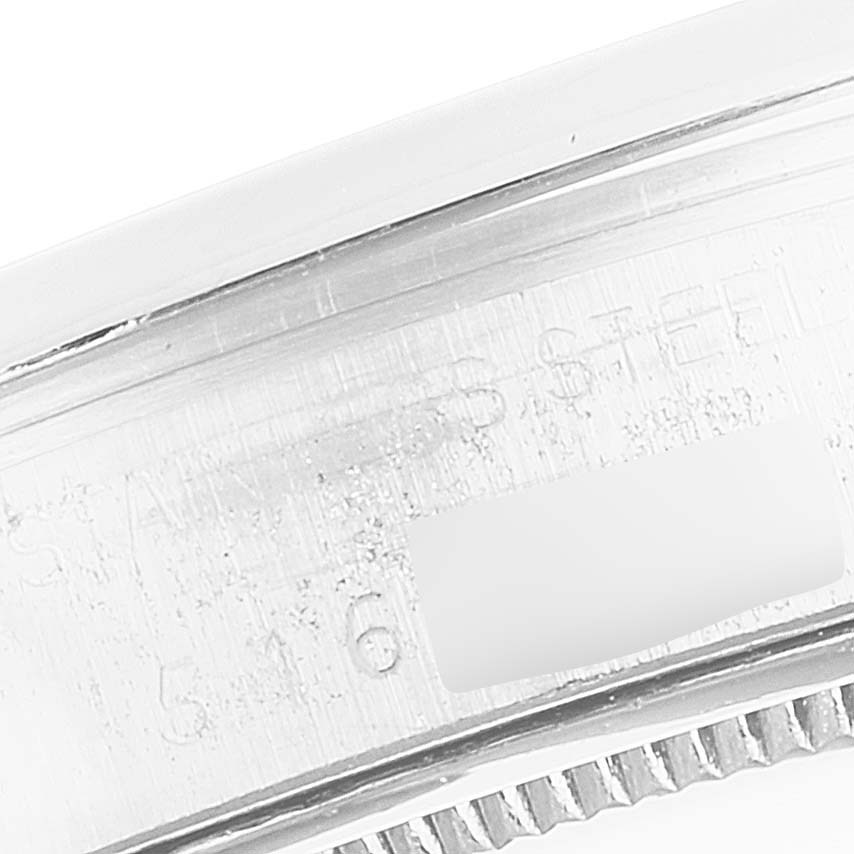 This image shows a close-up of the side of a Rolex Vintage Collection 6694 Men's Stainless Steel Brown Dial 6694 Men's Stainless Steel Brown Dial watch, highlighting the stainless steel casing and engraved details.