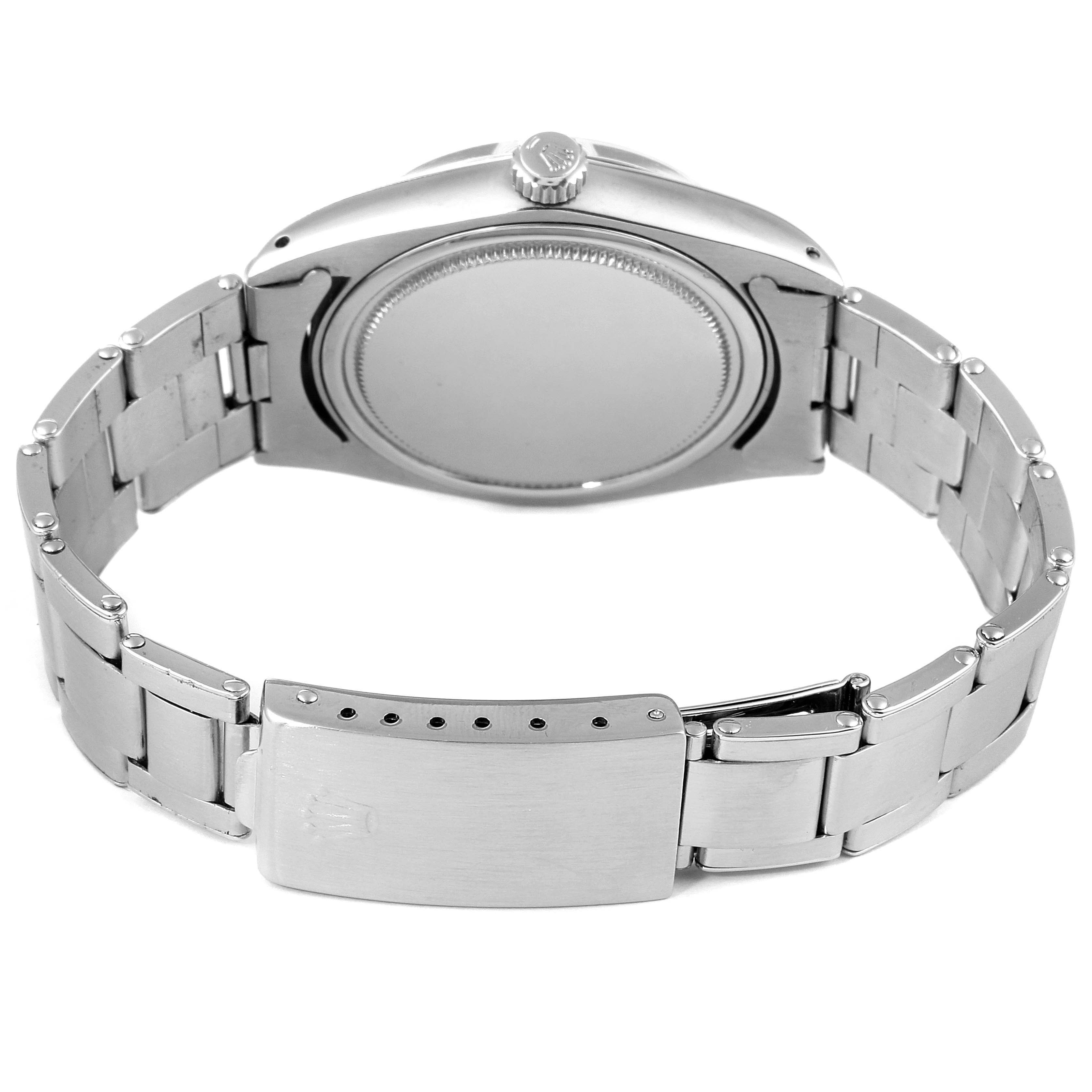 This image shows the backside of the Rolex Vintage Collection 6694 Men's Stainless Steel Silver Dial 6694 Men's Stainless Steel Silver Dial watch, highlighting the case back and bracelet with the clasp.