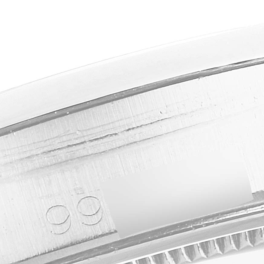 This image shows a close-up of the side and bezel of a Vintage Collection Rolex watch.