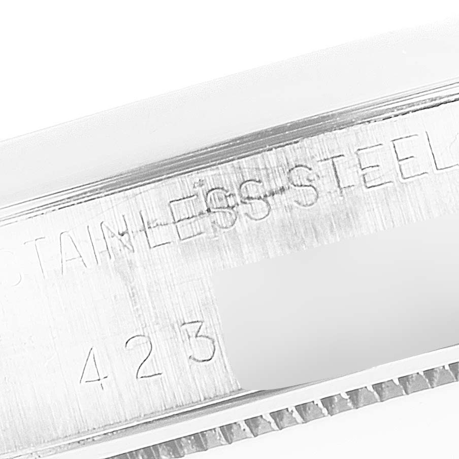 The image shows a close-up angle of the case edge with engraving on the Rolex Vintage Collection 6694 Men's Stainless Steel Champagne Dial 6694 Men's Stainless Steel Champagne Dial model watch.