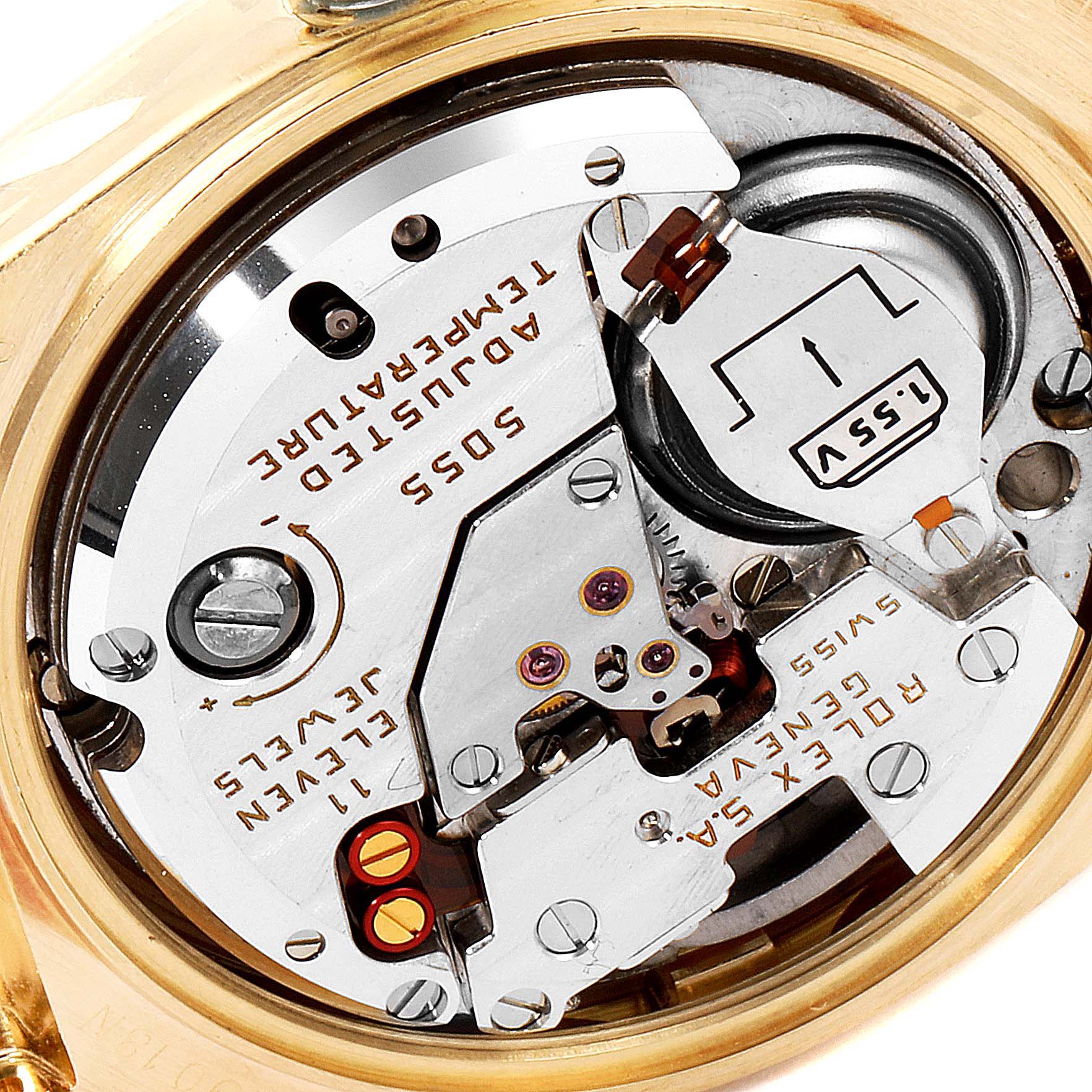 Close-up of the Rolex Oysterquartz 19018 Men's Yellow Gold Champagne Dial 19018 Men's Yellow Gold Champagne Dial movement showing internal components and engravings.