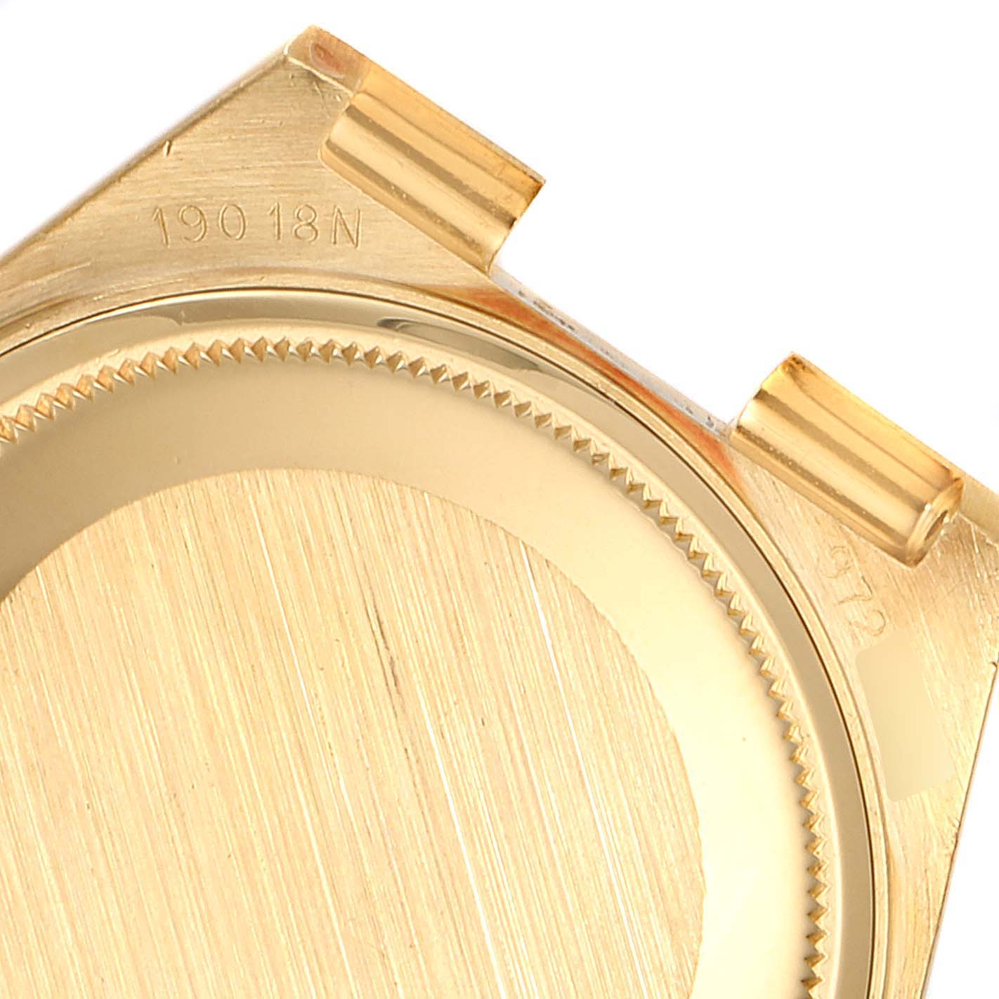 This image shows a close-up of the back casing and lugs of a Rolex Oysterquartz 19018 Men's Yellow Gold Champagne Dial 19018 Men's Yellow Gold Champagne Dial watch.