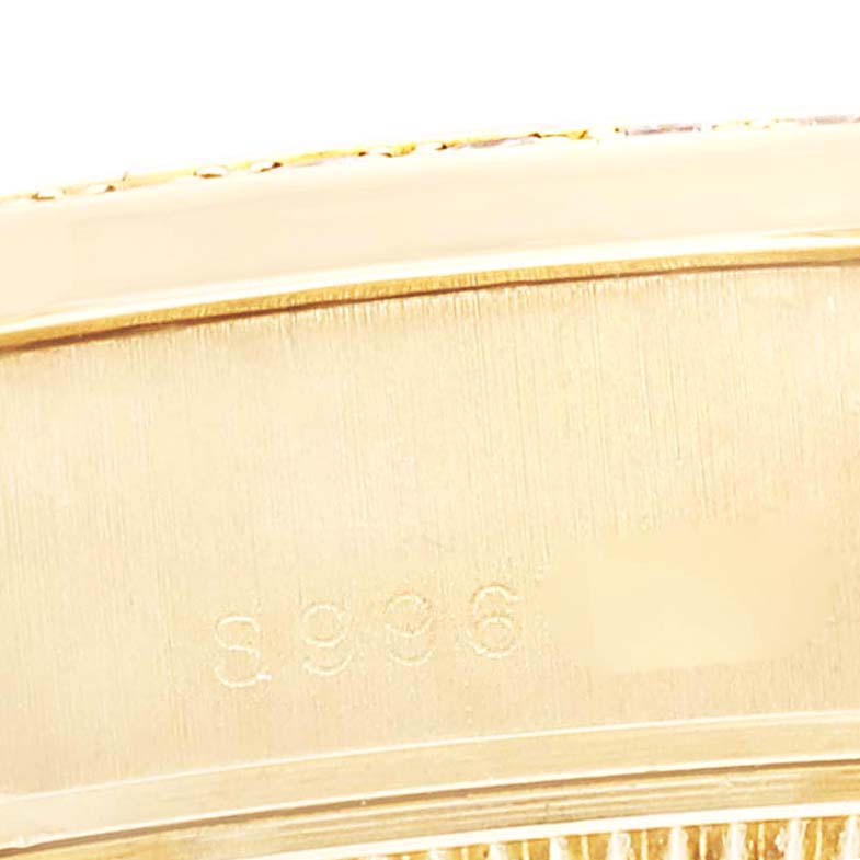 The image shows a close-up of the case back and reference number engraving on a Rolex President 69138G Women
s Yellow Gold Champagne Dial 69138G Women
s Yellow Gold Champagne Dial model watch.