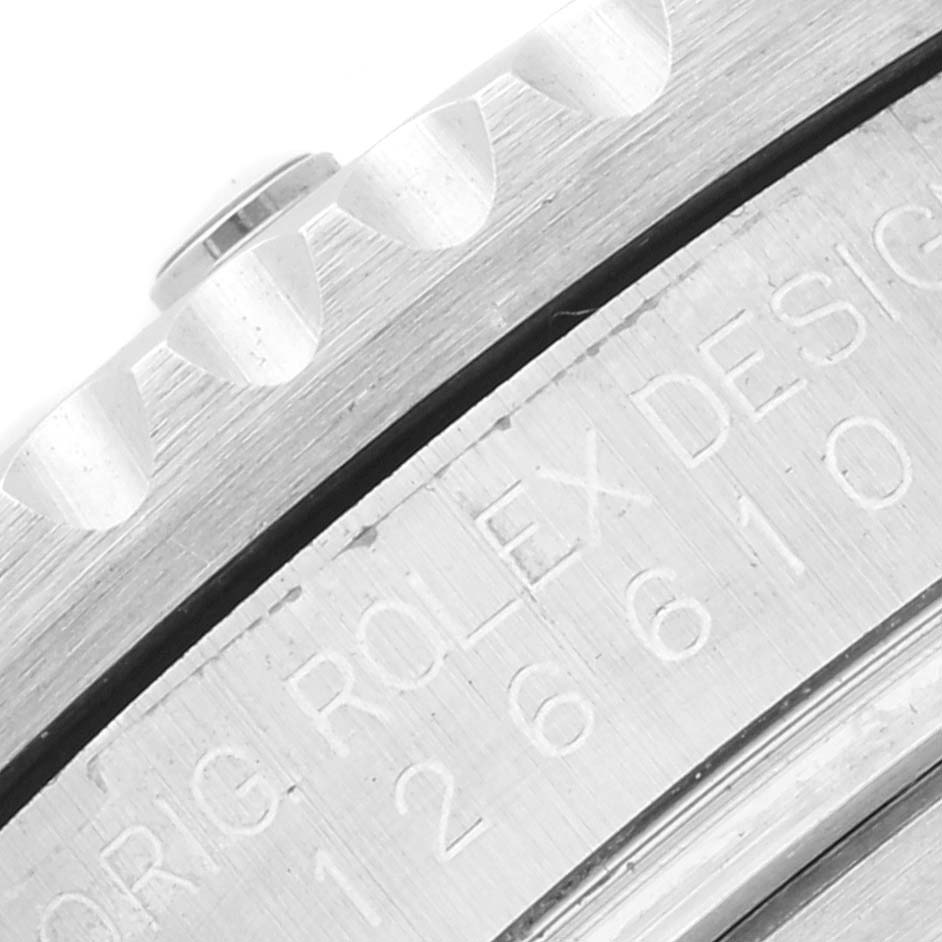 This close-up image shows the engraved bezel and part of the case of a Rolex Submariner 126610LN Men
s Stainless Steel Black Dial 126610LN Men
s Stainless Steel Black Dial watch.