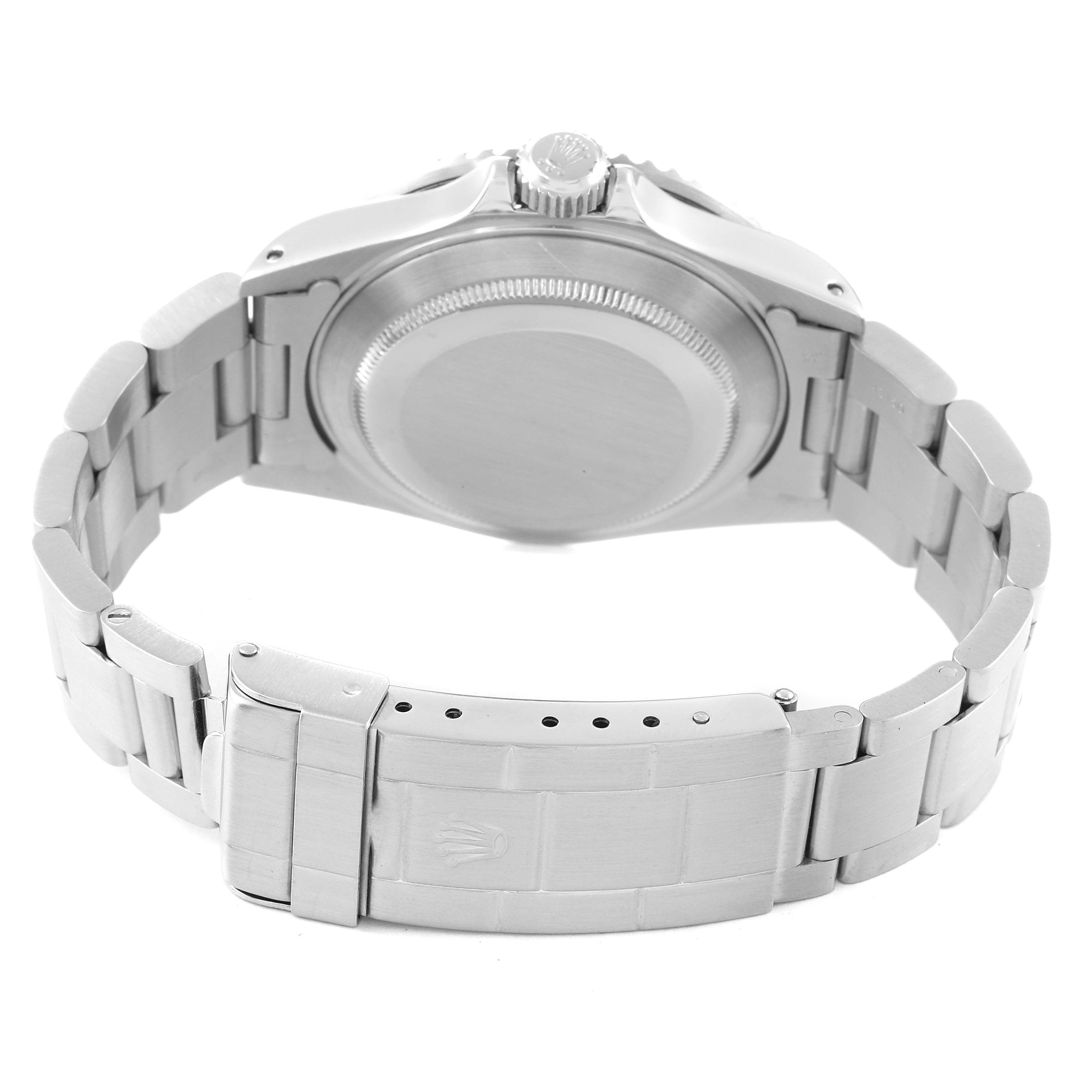 The image shows the back view of a Rolex Submariner 16610 Men
s Stainless Steel Black Dial 16610 Men
s Stainless Steel Black Dial watch, highlighting its clasp, bracelet, case back, and crown.