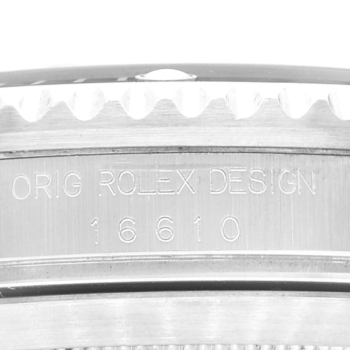 The image shows a close-up of the side bezel and engraved model number of a Rolex Submariner 16610 Men
s Stainless Steel Black Dial 16610 Men
s Stainless Steel Black Dial watch.
