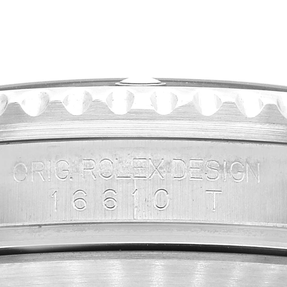 This is a close-up of the side of a Rolex Submariner 16610 Men
s Stainless Steel Black Dial 16610 Men
s Stainless Steel Black Dial watch showing the model number "16610 T" and "ORIG. ROLEX DESIGN" engraving.
