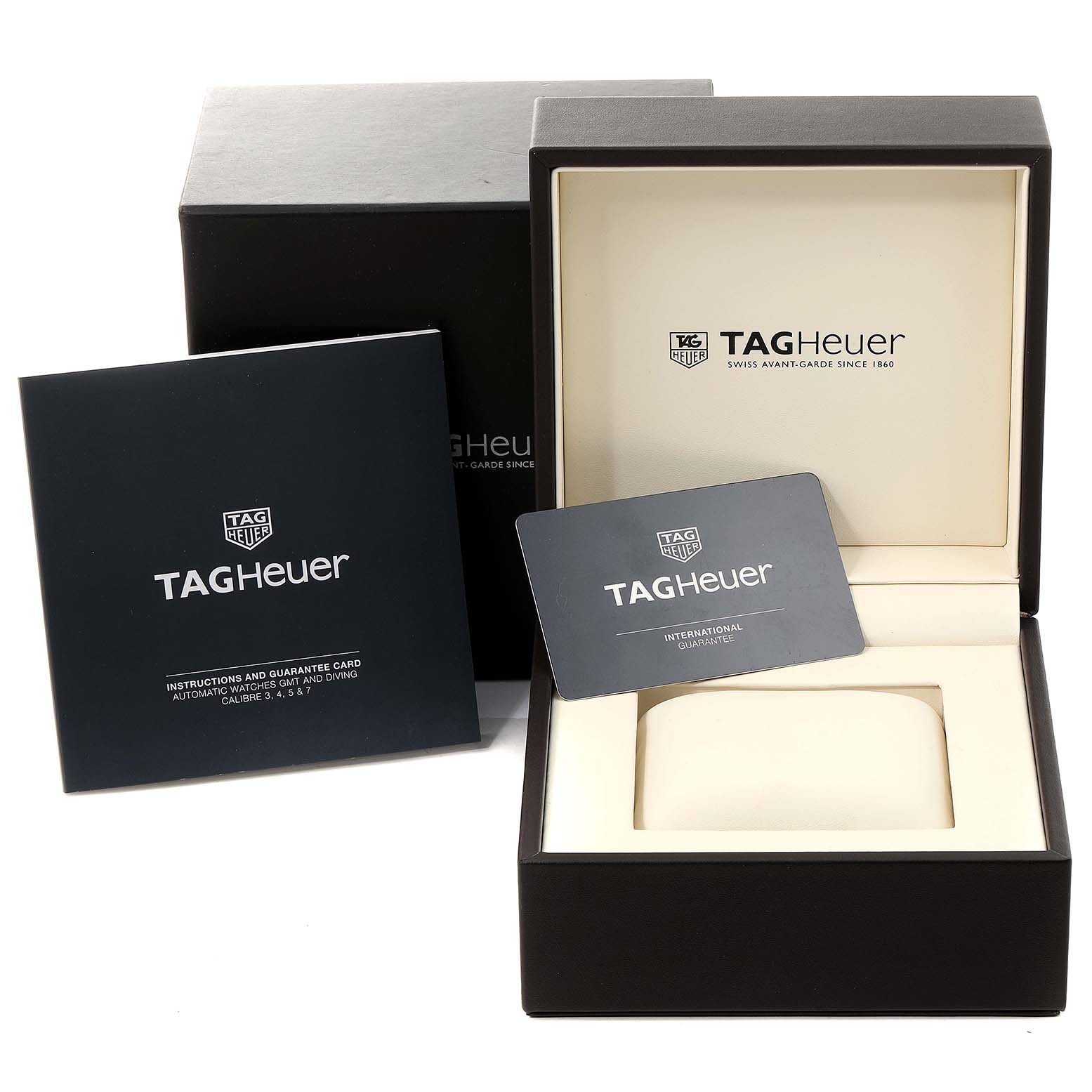 The image shows the packaging, instruction manual, and guarantee card for a Tag Heuer Carrera WAR201C.BA0723 Men
s Stainless Steel Black Dial WAR201C.BA0723 Men
s Stainless Steel Black Dial watch.