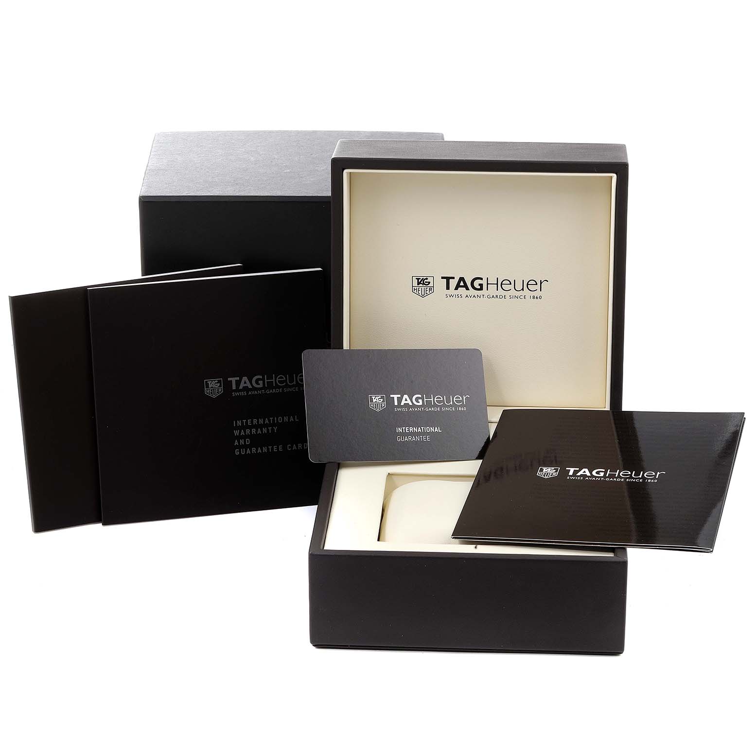 The image shows the packaging, international guarantee card, and booklets for the Tag Heuer Link CAT2015.BA0952 Men's Stainless Steel Blue Dial CAT2015.BA0952 Men's Stainless Steel Blue Dial model watch.