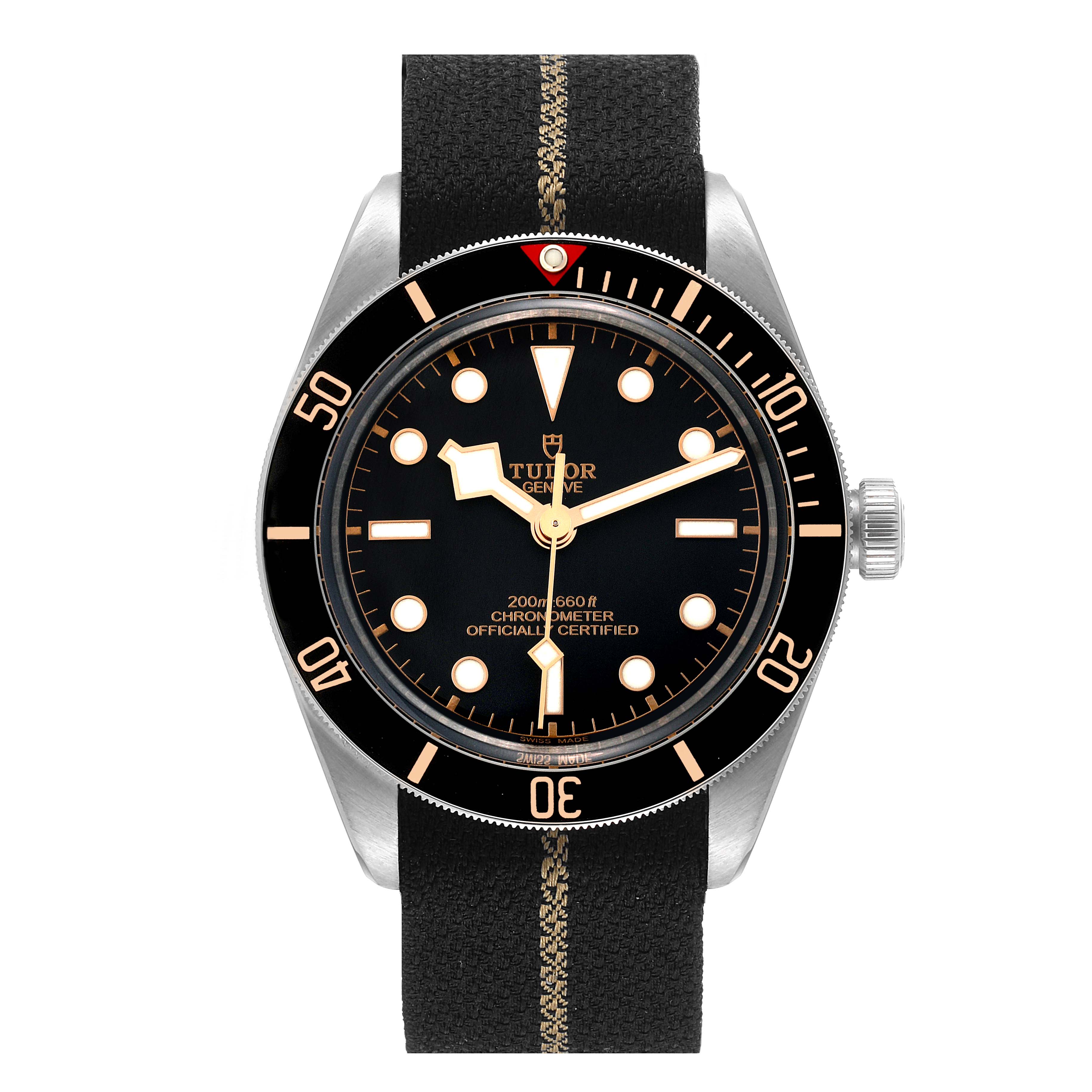 The image shows a front view of the Tudor Heritage Black Bay 79030N Men's Stainless Steel Black Dial 79030N Men's Stainless Steel Black Dial watch, highlighting its dial, bezel, and fabric strap.