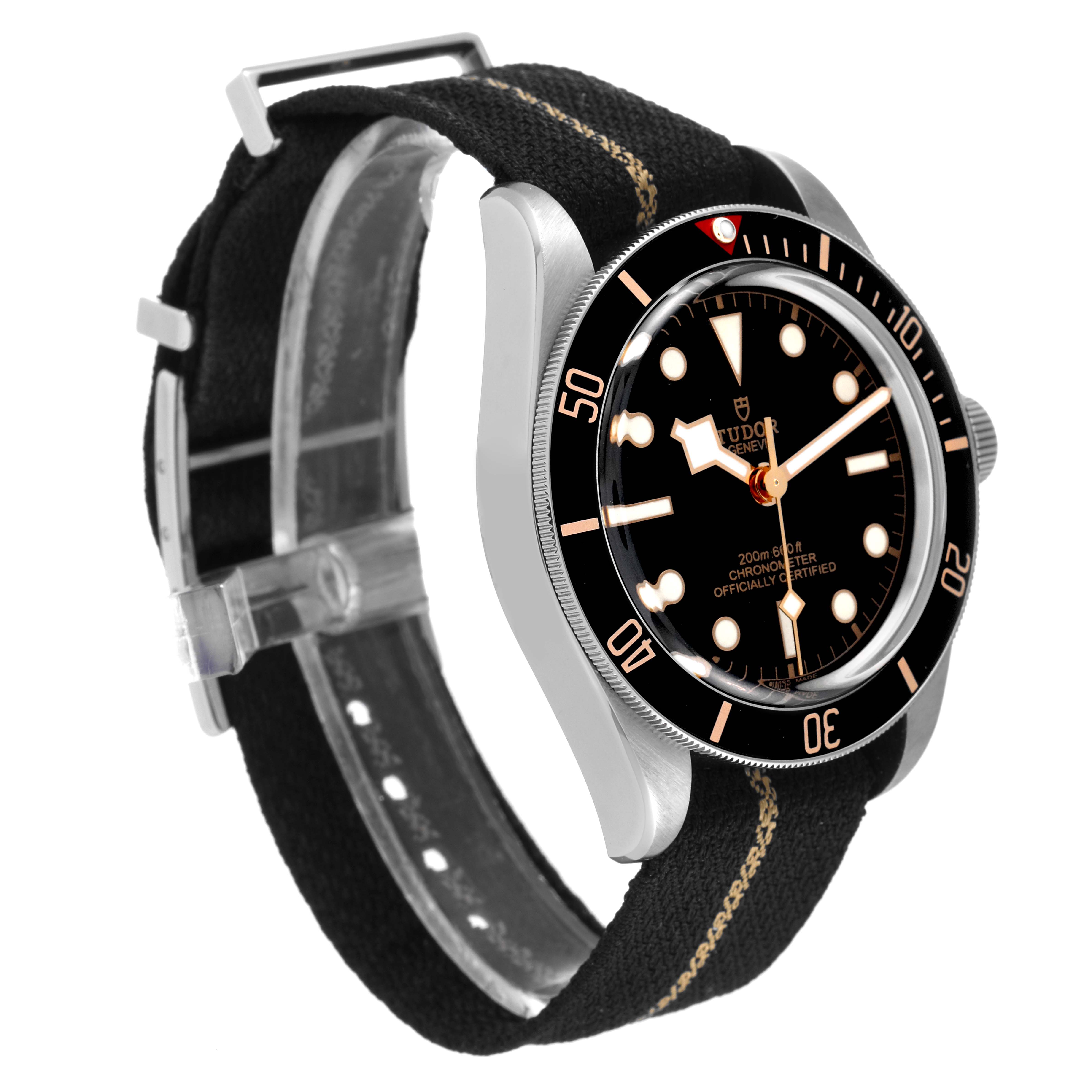 The image shows a Tudor Heritage Black Bay 79030N Men's Stainless Steel Black Dial 79030N Men's Stainless Steel Black Dial watch at an angle highlighting its black dial and bezel, and fabric strap.