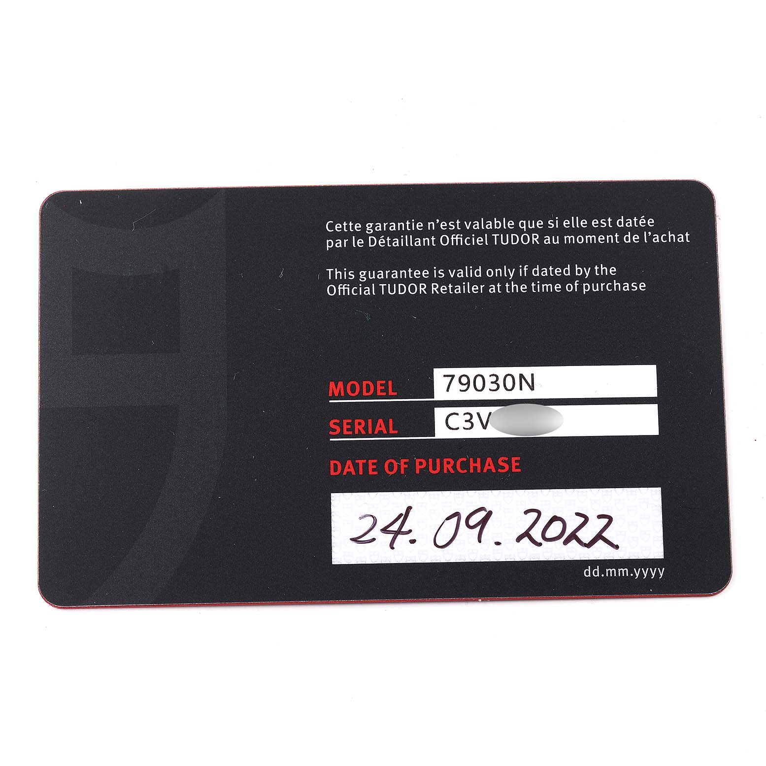 This image shows a warranty card for the Tudor Heritage Black Bay 79030N Men's Stainless Steel Black Dial 79030N Men's Stainless Steel Black Dial model 79030N, including the serial number and date of purchase.