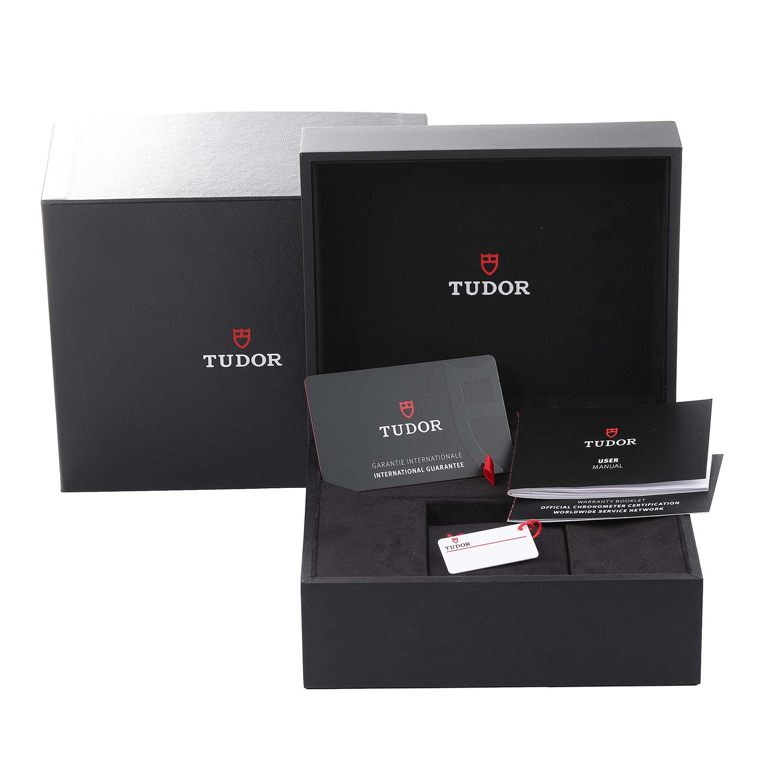 The image shows the packaging, international guarantee card, user manual, and hang tag for the Tudor Heritage Black Bay 79030N Men's Stainless Steel Black Dial 79030N Men's Stainless Steel Black Dial watch.