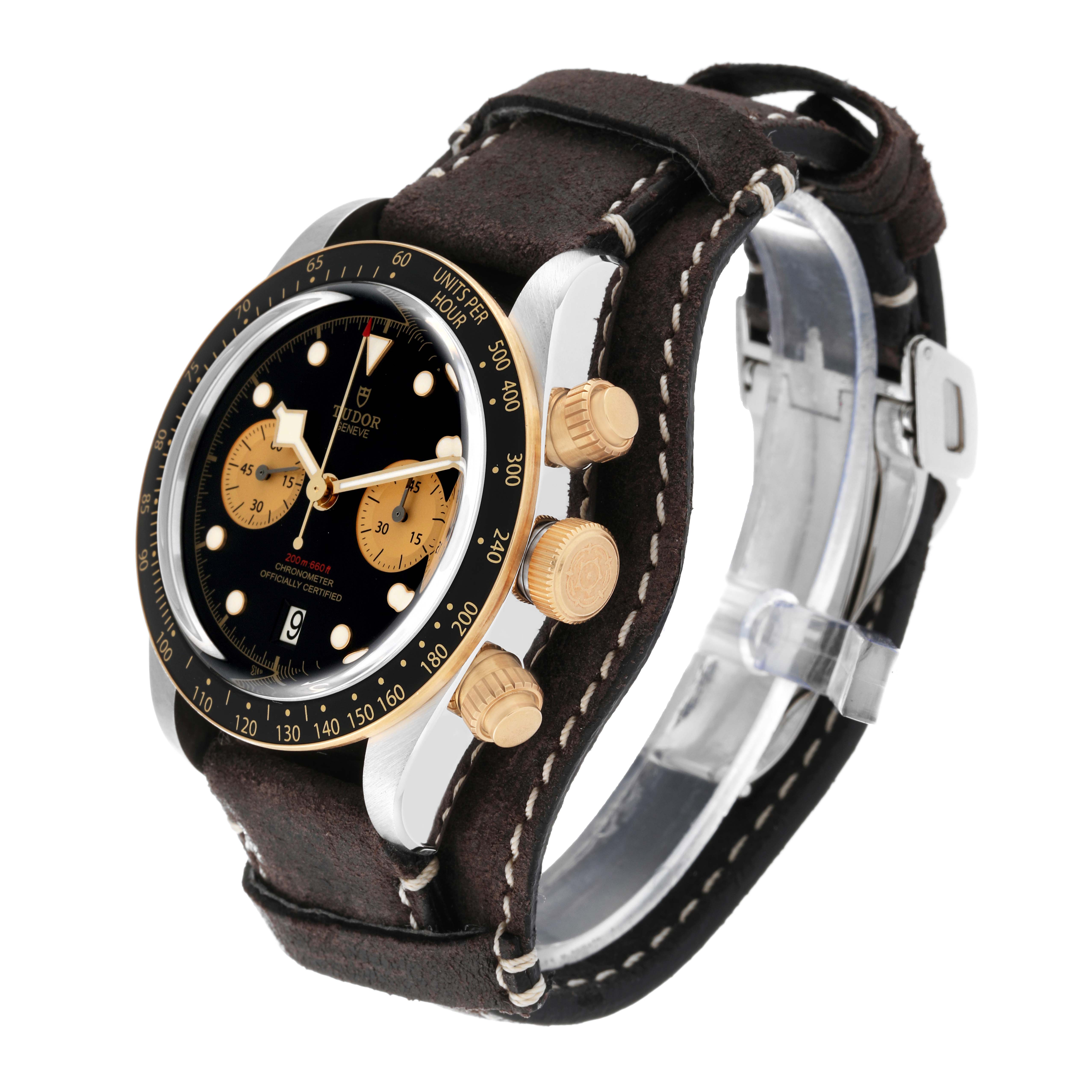 The image shows a Tudor Heritage Black Bay 79363N Men
s Steel and Gold (two tone) Black Dial 79363N Men
s Steel and Gold (two tone) Black Dial watch angled to display its dial, bezel, crown, pushers, and leather strap.