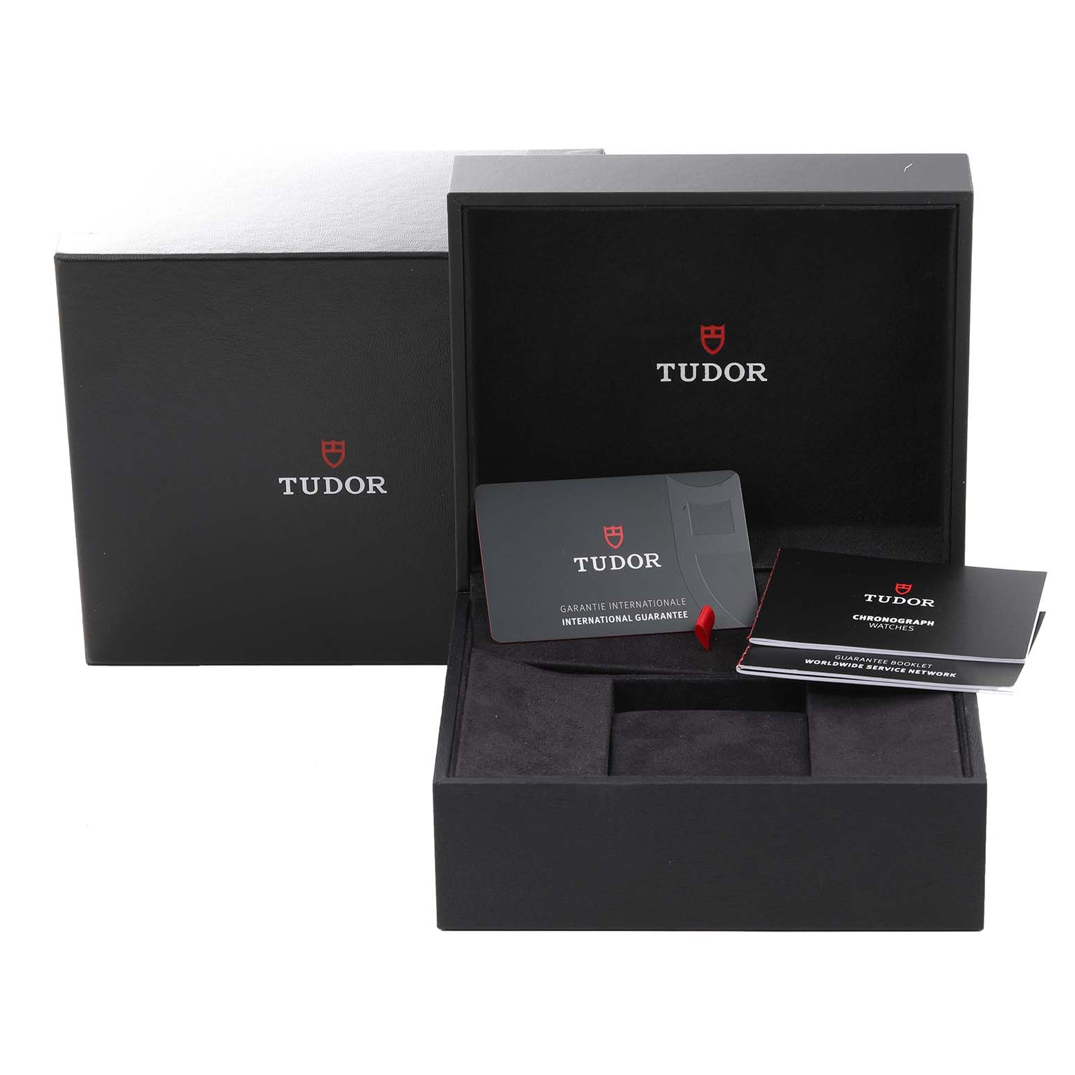 The image shows the Tudor Heritage Black Bay 79363N Men
s Steel and Gold (two tone) Black Dial 79363N Men
s Steel and Gold (two tone) Black Dial watch
s packaging, international guarantee card, and documentation from a front angle.