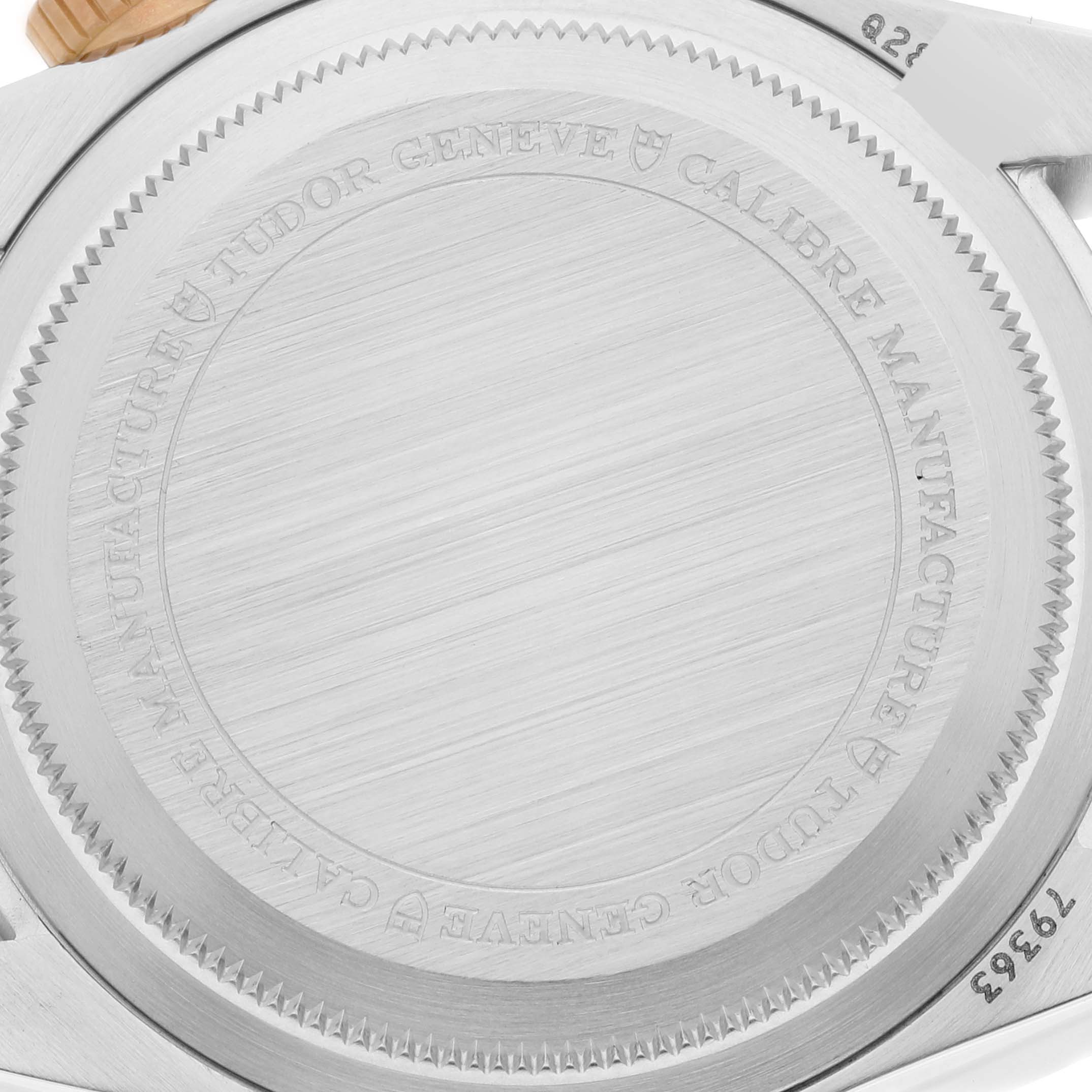 The image shows a close-up of the case back of a Tudor Heritage Black Bay 79363N Men
s Steel and Gold (two tone) Black Dial 79363N Men
s Steel and Gold (two tone) Black Dial watch.