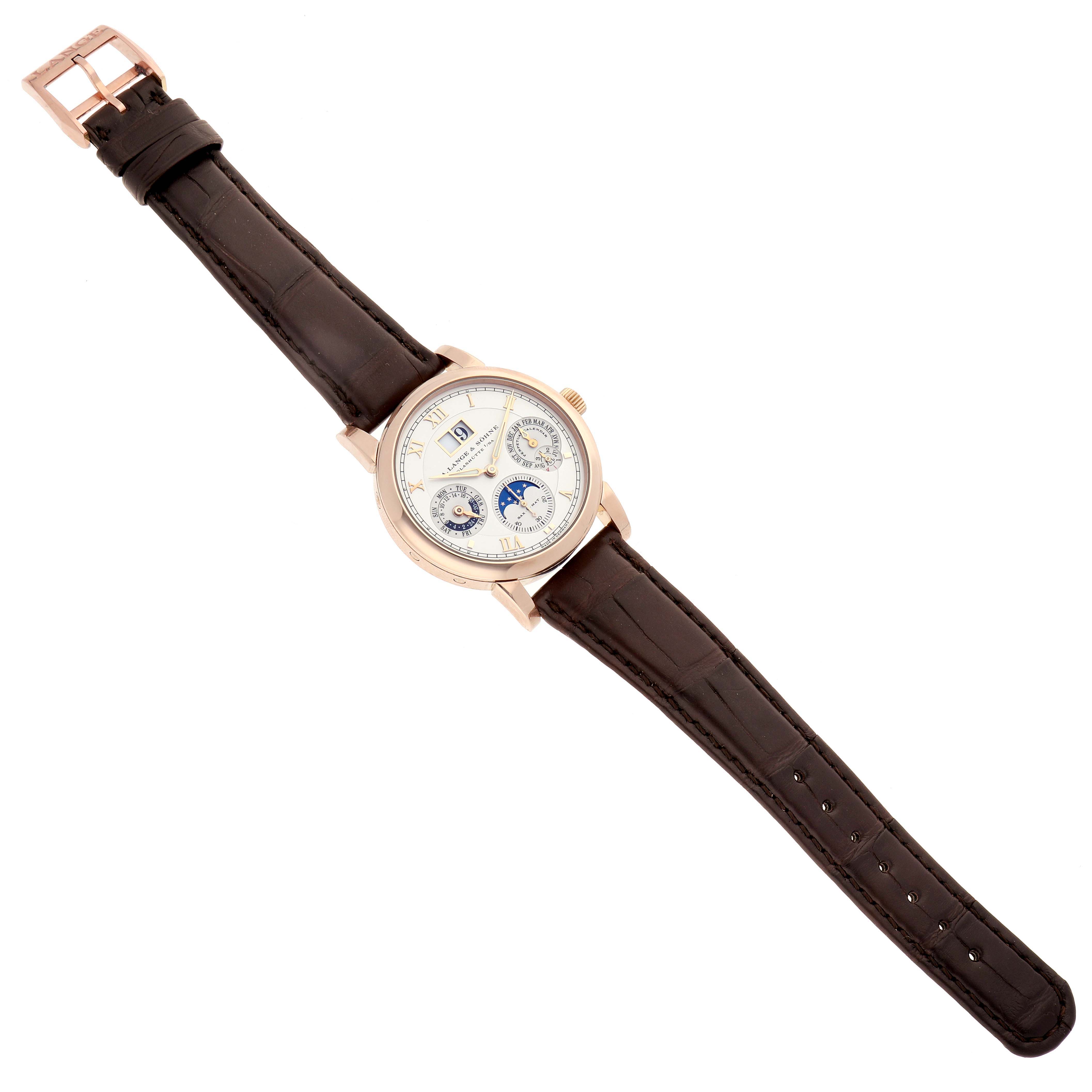 The Richard Lange by A. Lange & Söhne is shown from a top-down angle, displaying the dial, case, and full leather strap.