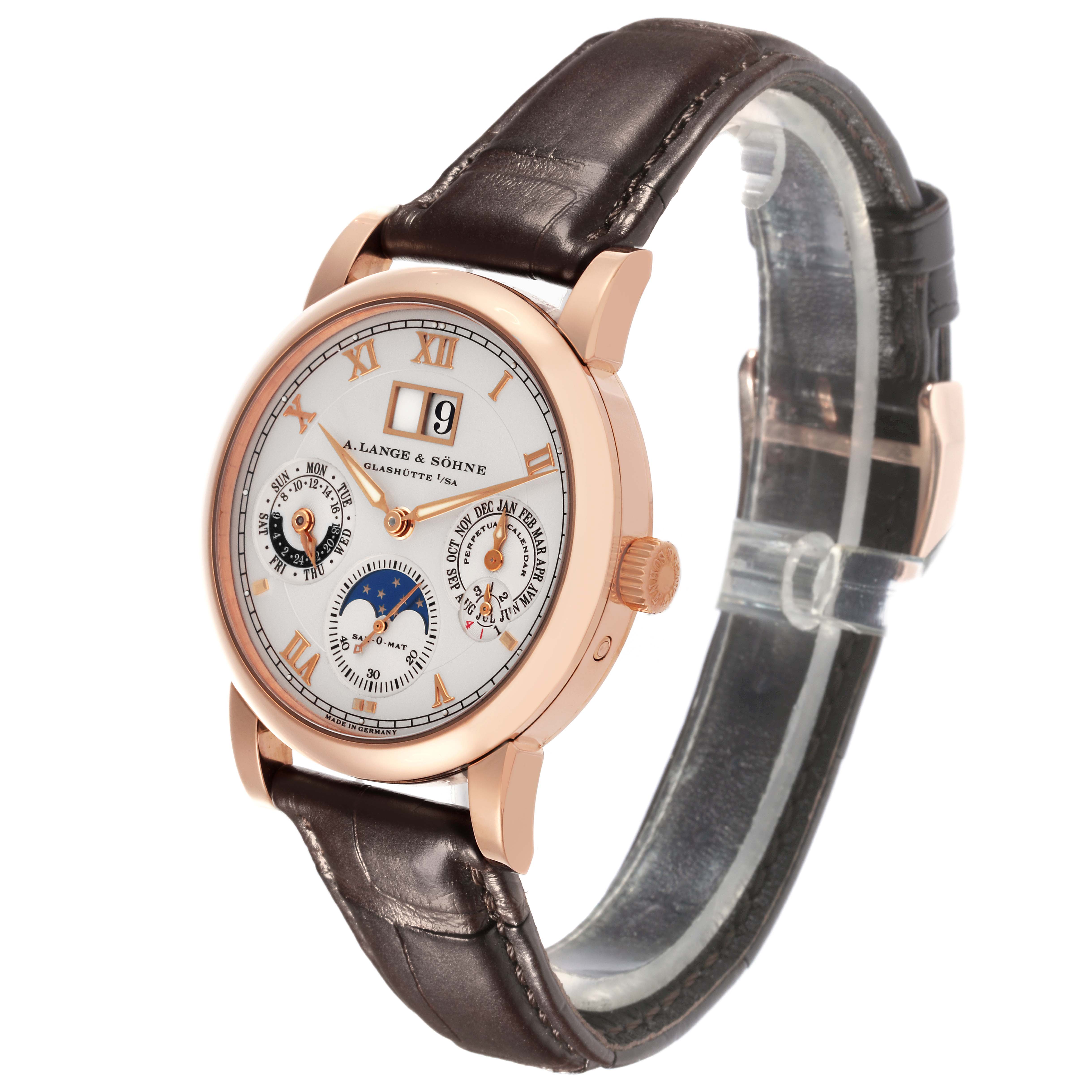 The Richard Lange watch by A. Lange & Söhne is shown at a three-quarter angle, displaying the dial, crown, and leather strap.