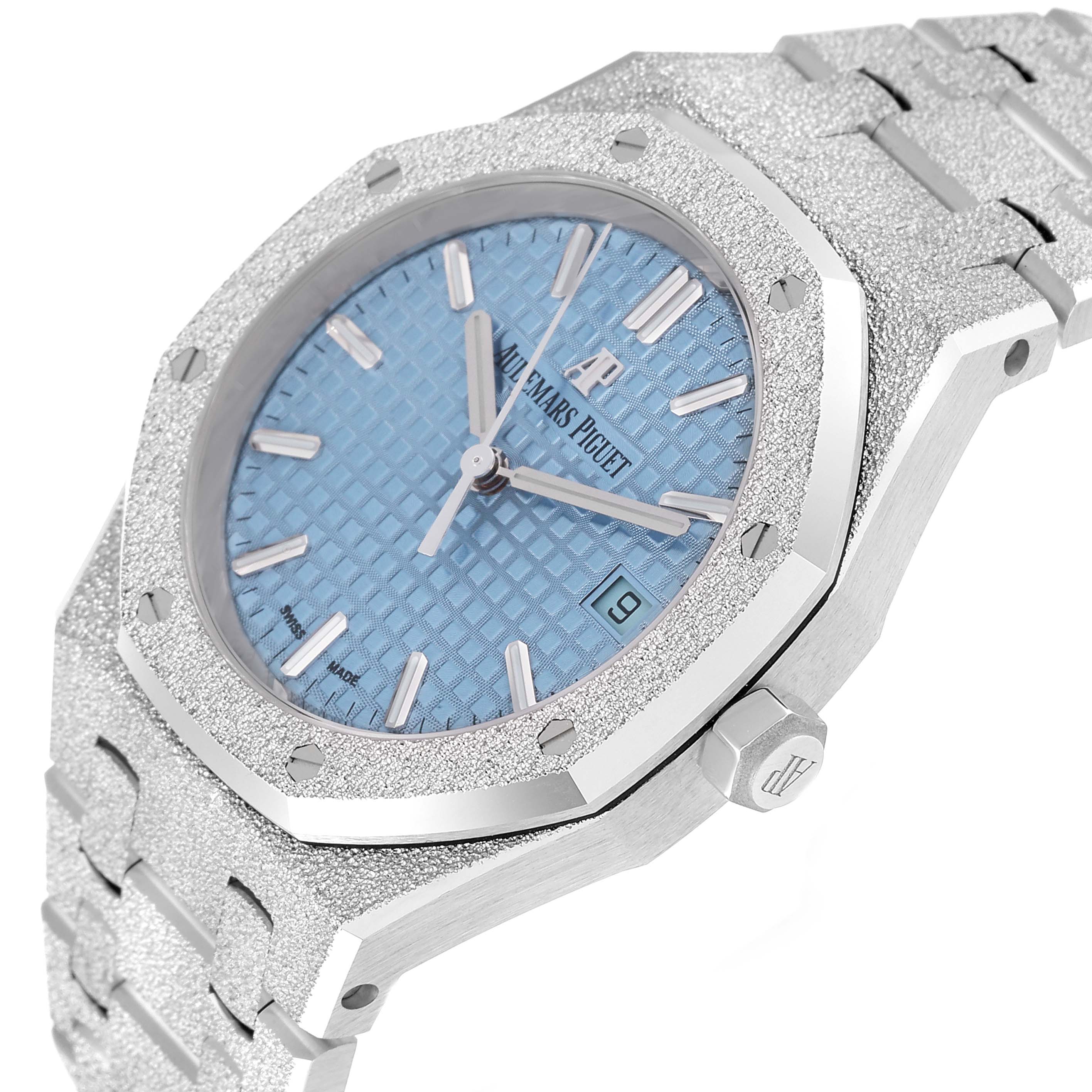 This image shows an Audemars Piguet Royal Oak 77353BC.GG.1263BC.01 Women's White Gold Blue Dial 77353BC.GG.1263BC.01 Women's White Gold Blue Dial watch at an angled close-up, highlighting the dial, bezel, crown, and part of the bracelet.