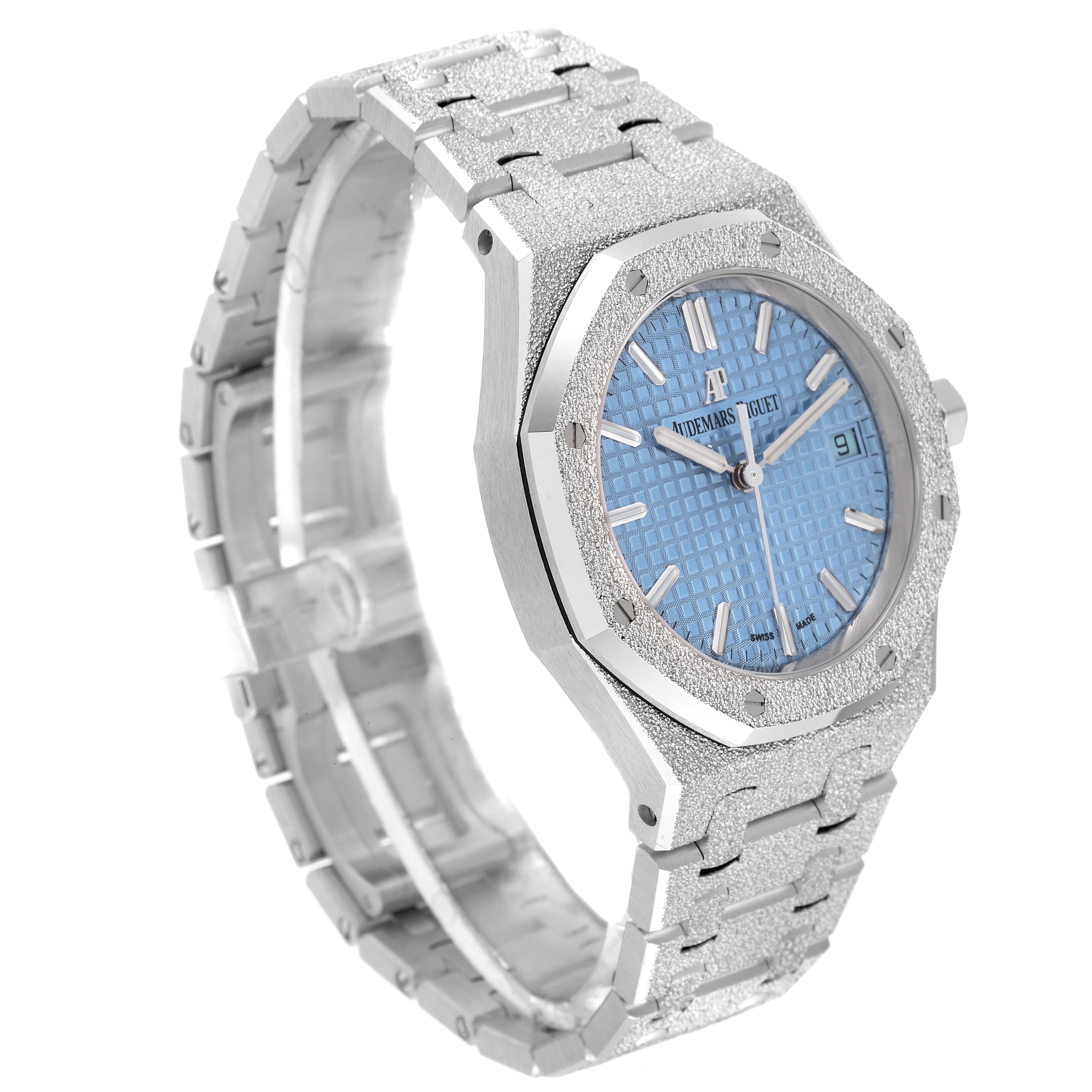 The image shows an angled view of an Audemars Piguet Royal Oak 77353BC.GG.1263BC.01 Women's White Gold Blue Dial 77353BC.GG.1263BC.01 Women's White Gold Blue Dial watch, highlighting its case, bezel, bracelet, and blue dial.