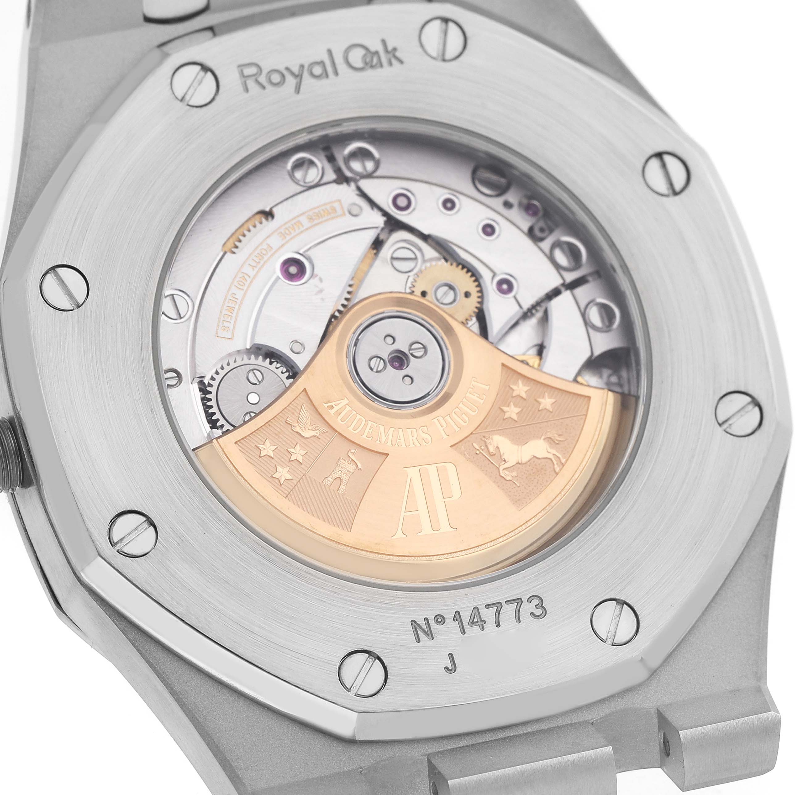 The image shows the back of an Audemars Piguet Royal Oak 15400ST.OO.1220ST.02 Men's Stainless Steel Silver Dial, highlighting its visible movement and engravings.