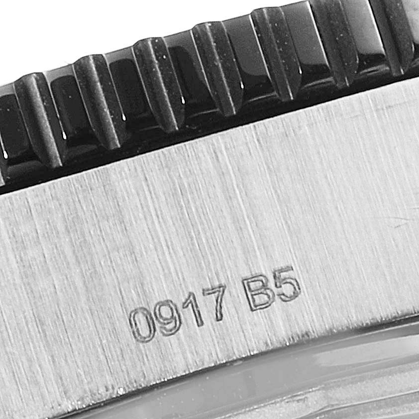 The image shows a close-up of the bezel and engraved serial number on a Breitling Superocean Y17393 Men's Stainless Steel Black Dial Y17393 Men's Stainless Steel Black Dial watch.