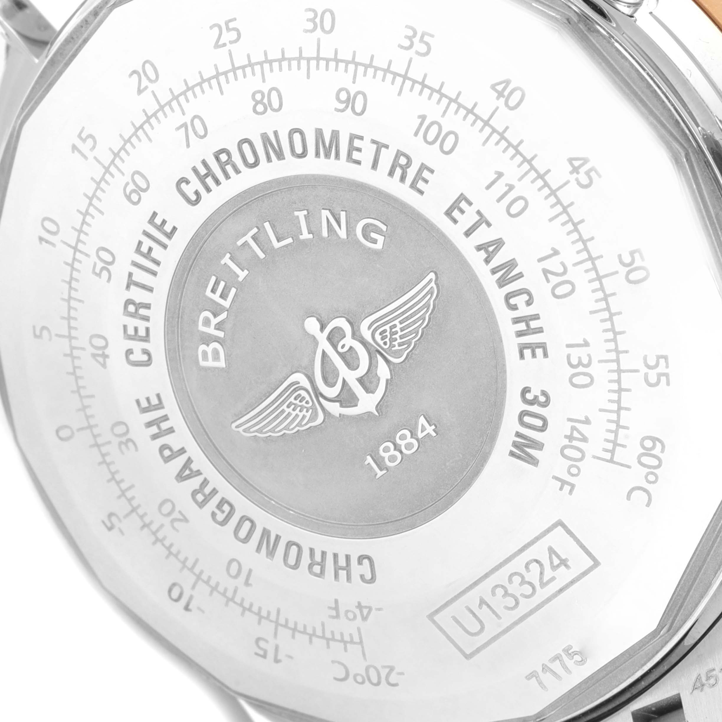 The image shows the case back of a Breitling Navitimer U13324211B1X1 Men's Steel and Gold (two tone) Black Dial U13324211B1X1 Men's Steel and Gold (two tone) Black Dial watch, displaying its engravings and specifications.