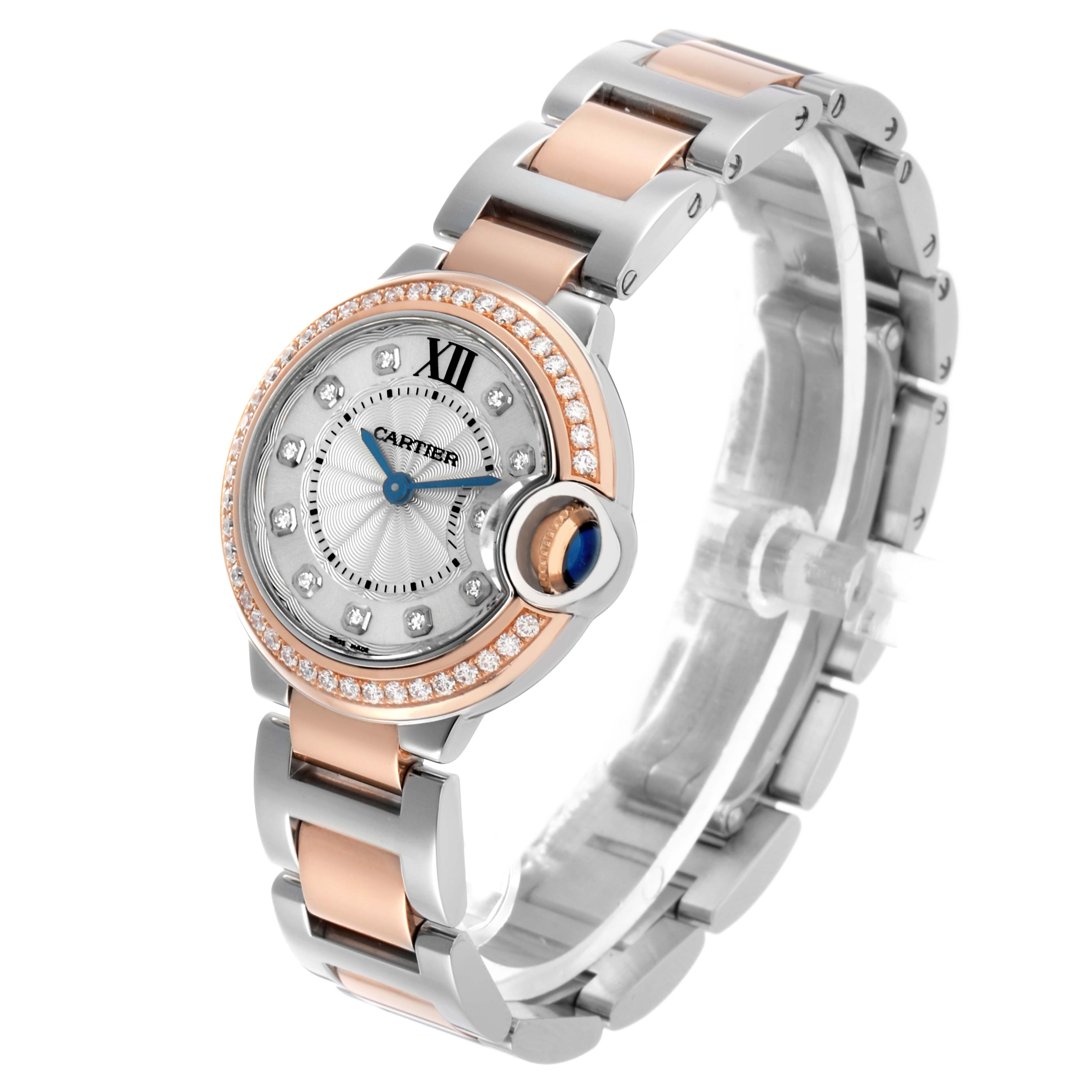 The Ballon Bleu de Cartier watch is shown at a slight angle, highlighting the dial, bezel, crown, and part of the bracelet.