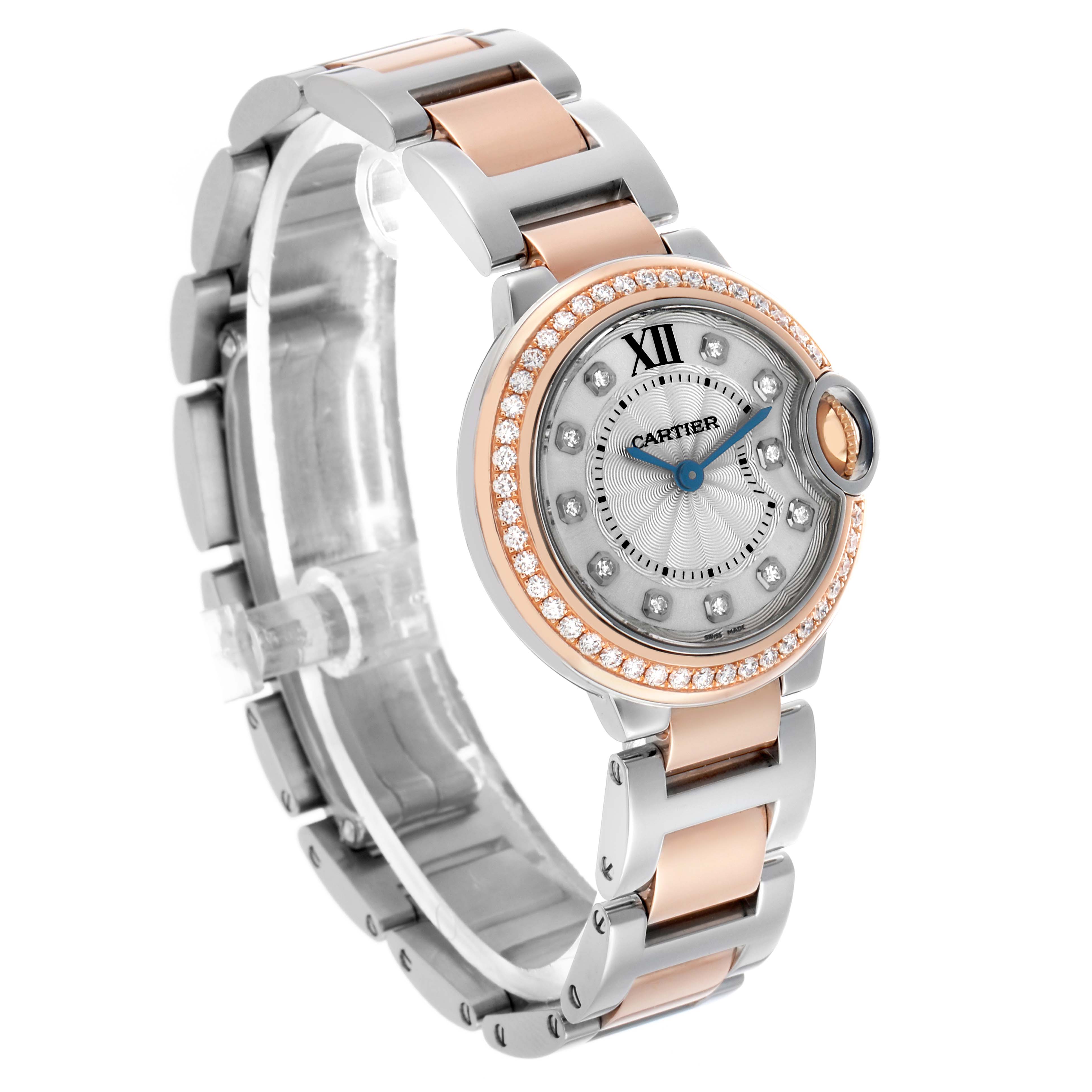 The Cartier Ballon Bleu WE902076 Women's Steel and Gold (two tone) Silver Dial watch is shown at a three-quarter angle, highlighting the dial, bezel, and bracelet detailing.