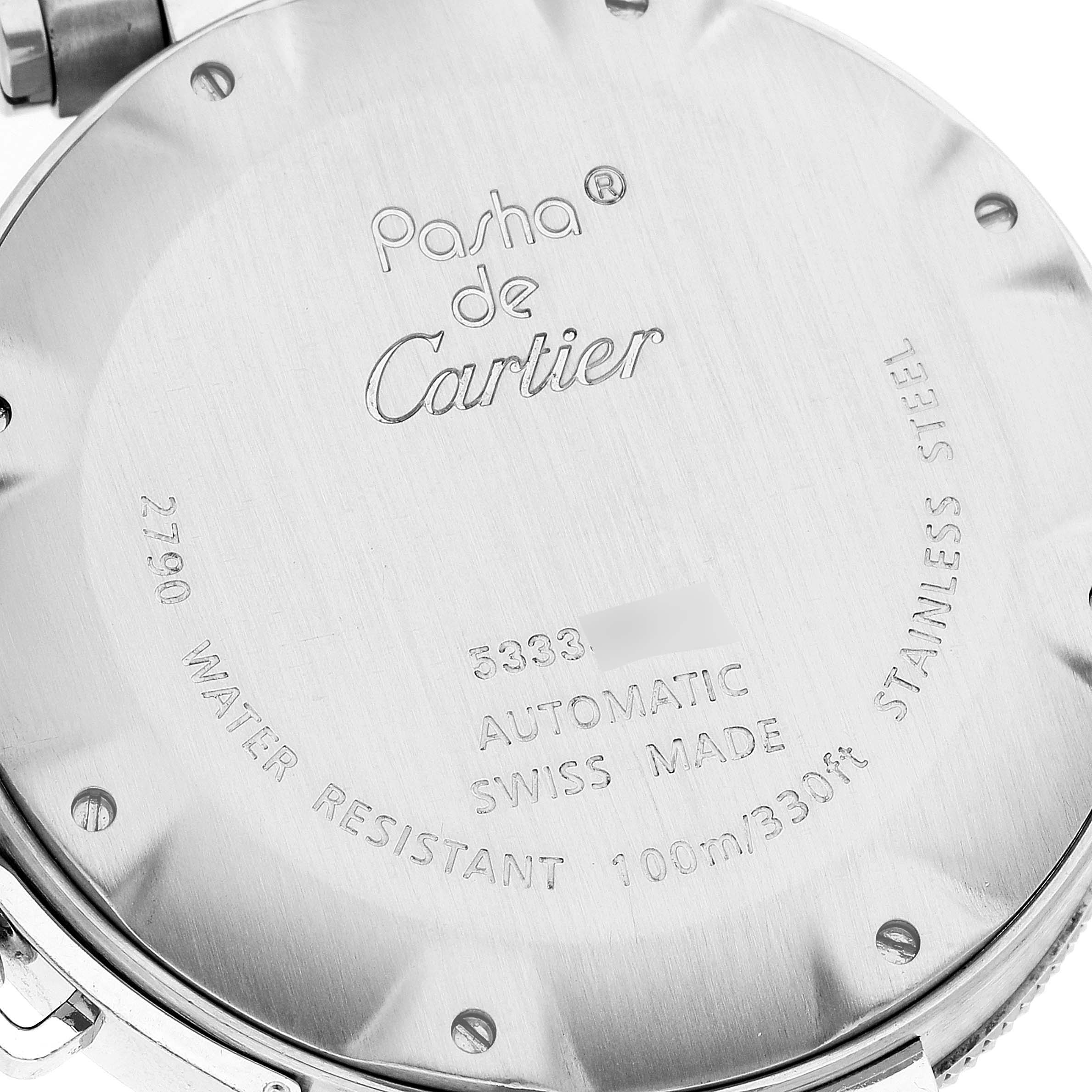 This image shows the case back of a Pasha de Cartier watch, featuring its inscriptions and details.