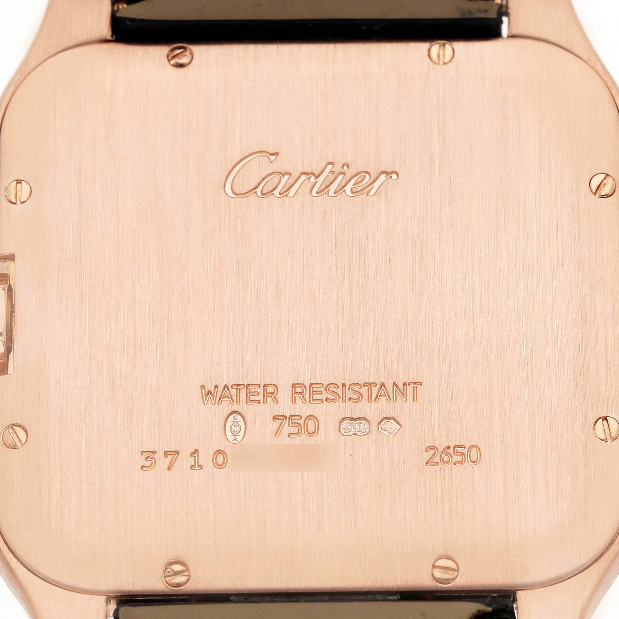The image shows the back of a Cartier Santos Dumont W2006951 Men's Rose Gold Silver Dial watch, highlighting the brand logo, water resistance, and serial number.