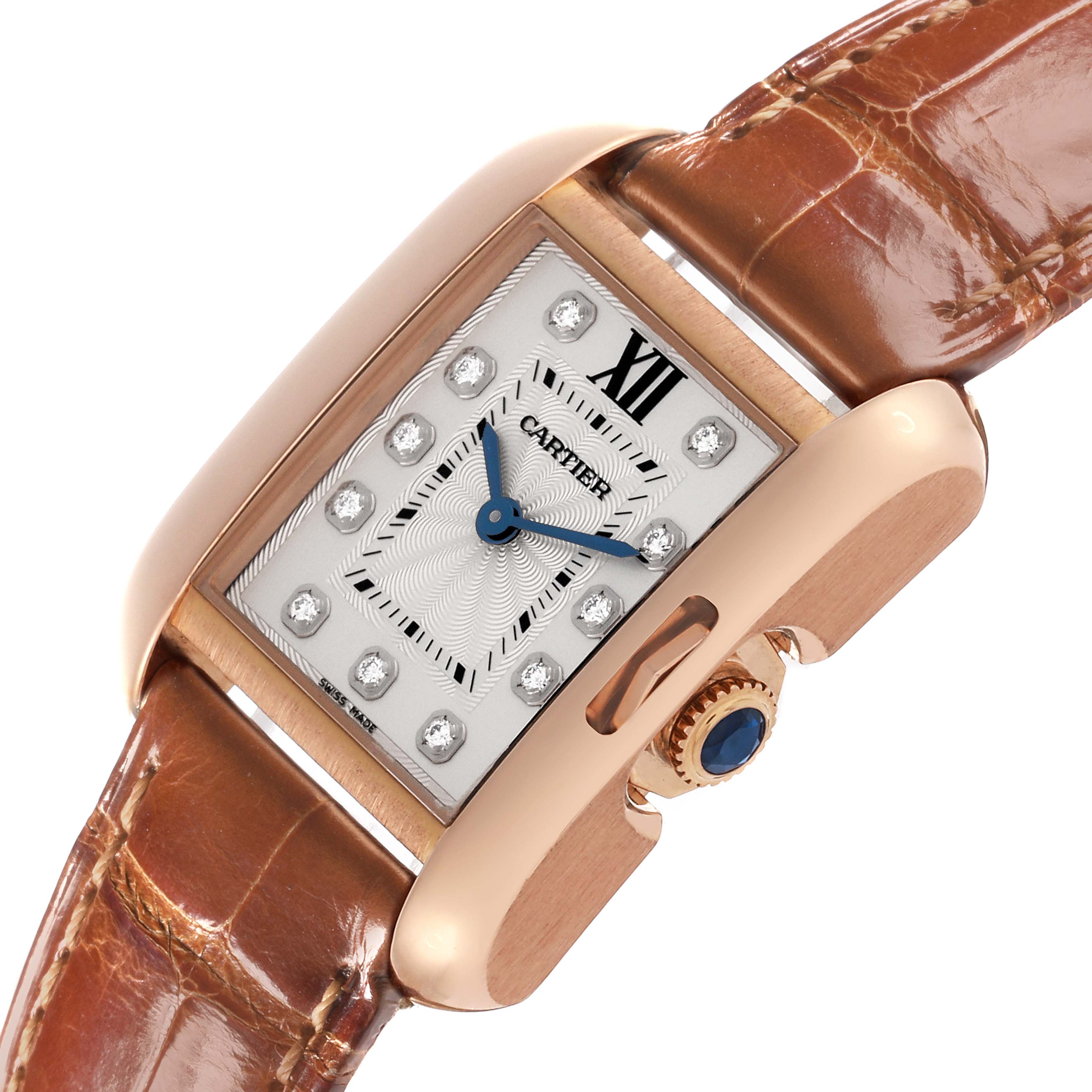 The Cartier Tank Anglaise WJTA0007 Women
s Rose Gold Silver Dial WJTA0007 Women
s Rose Gold Silver Dial watch is shown at an angled view, highlighting its face, crown, and leather strap.