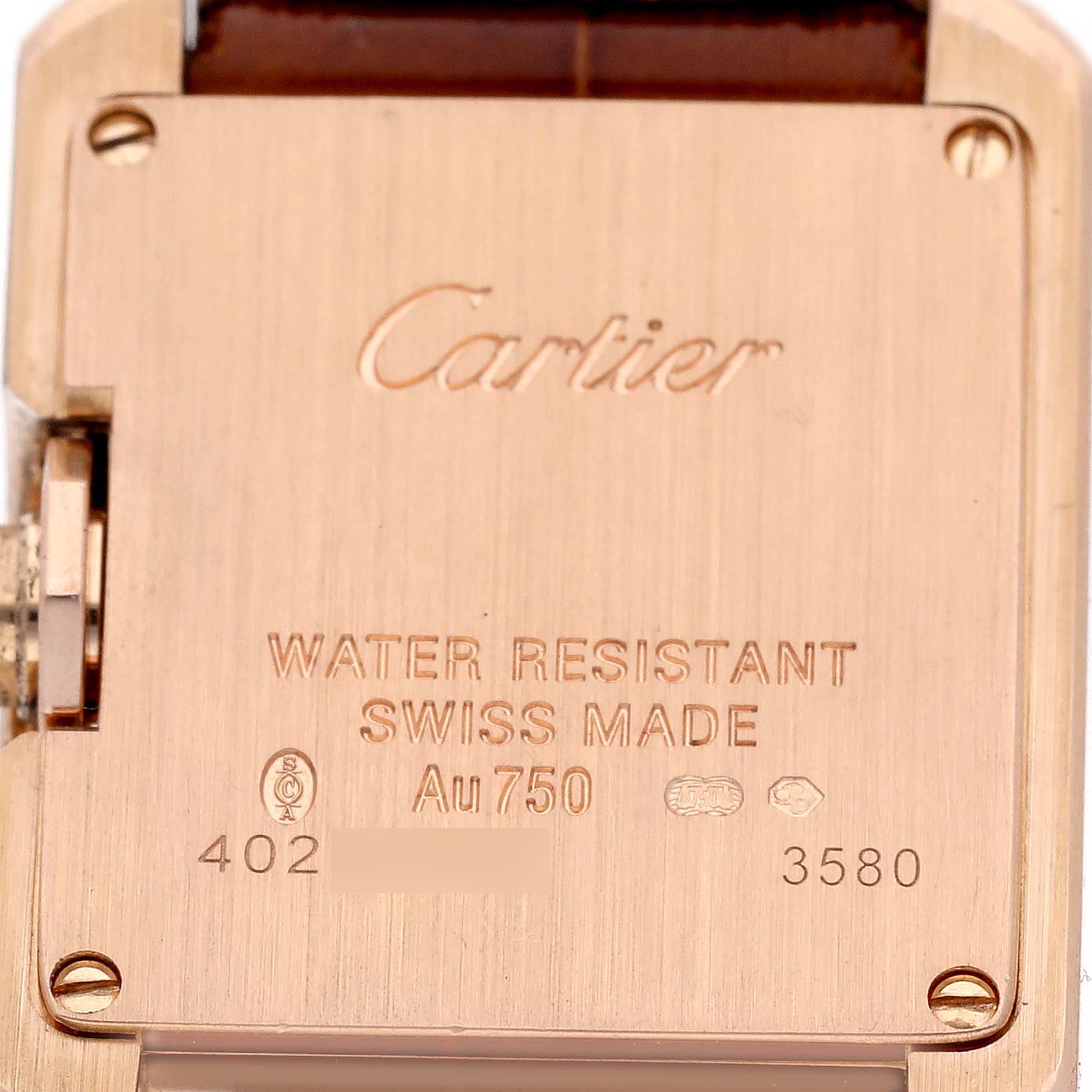 The image shows the back and inscriptions of a Cartier Tank Anglaise WJTA0007 Women
s Rose Gold Silver Dial WJTA0007 Women
s Rose Gold Silver Dial watch.
