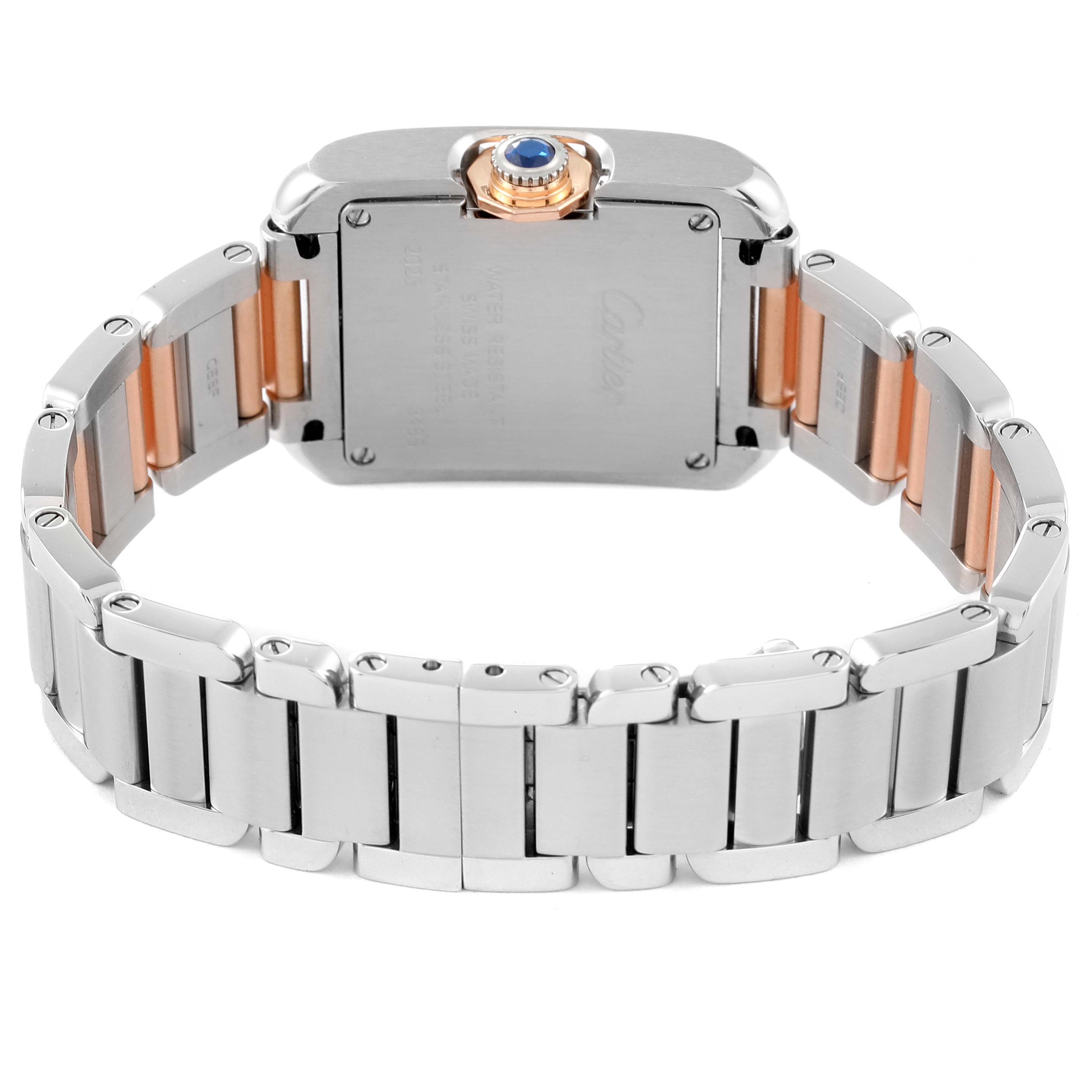 This image shows the back view of a Cartier Tank Anglaise W5310036 Women's Steel and Gold (two tone) Silver Dial W5310036 Women's Steel and Gold (two tone) Silver Dial watch, highlighting its case, bracelet, and a blue gemstone on the crown.