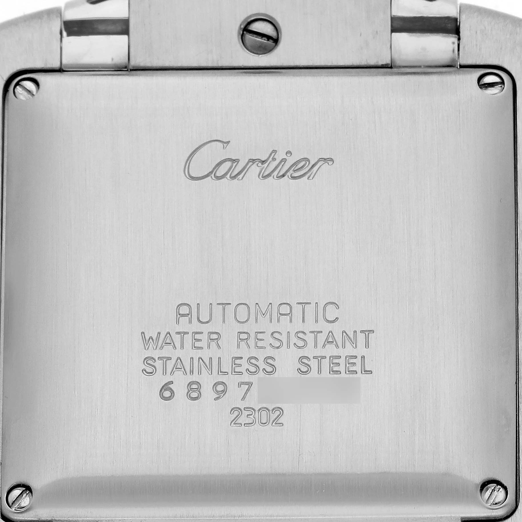 The image shows the back case of the Cartier Tank Française, featuring branding and specifications like "automatic" and "stainless steel."