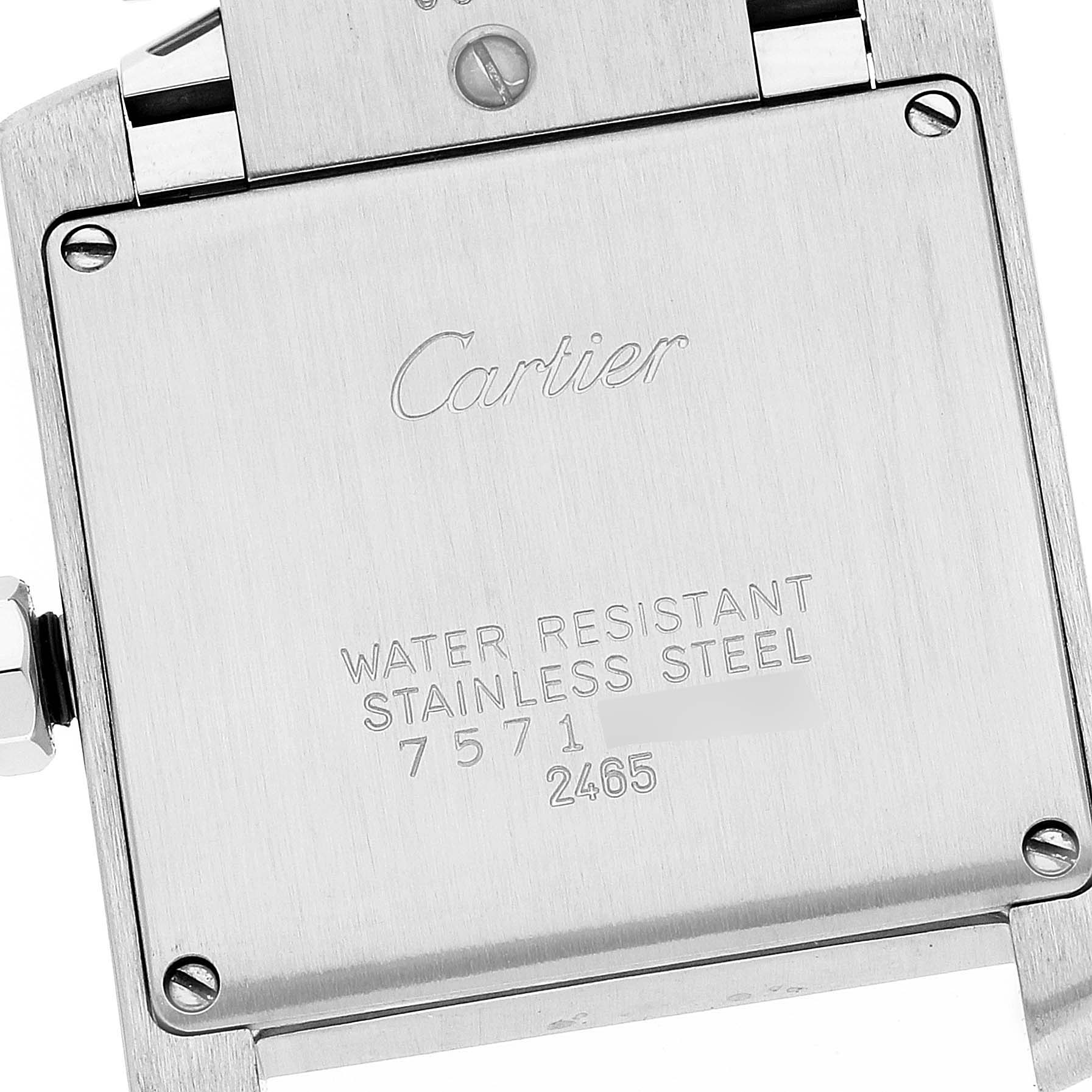 The image shows the engraved back case of the Tank Francaise watch by Cartier at a close-up angle.