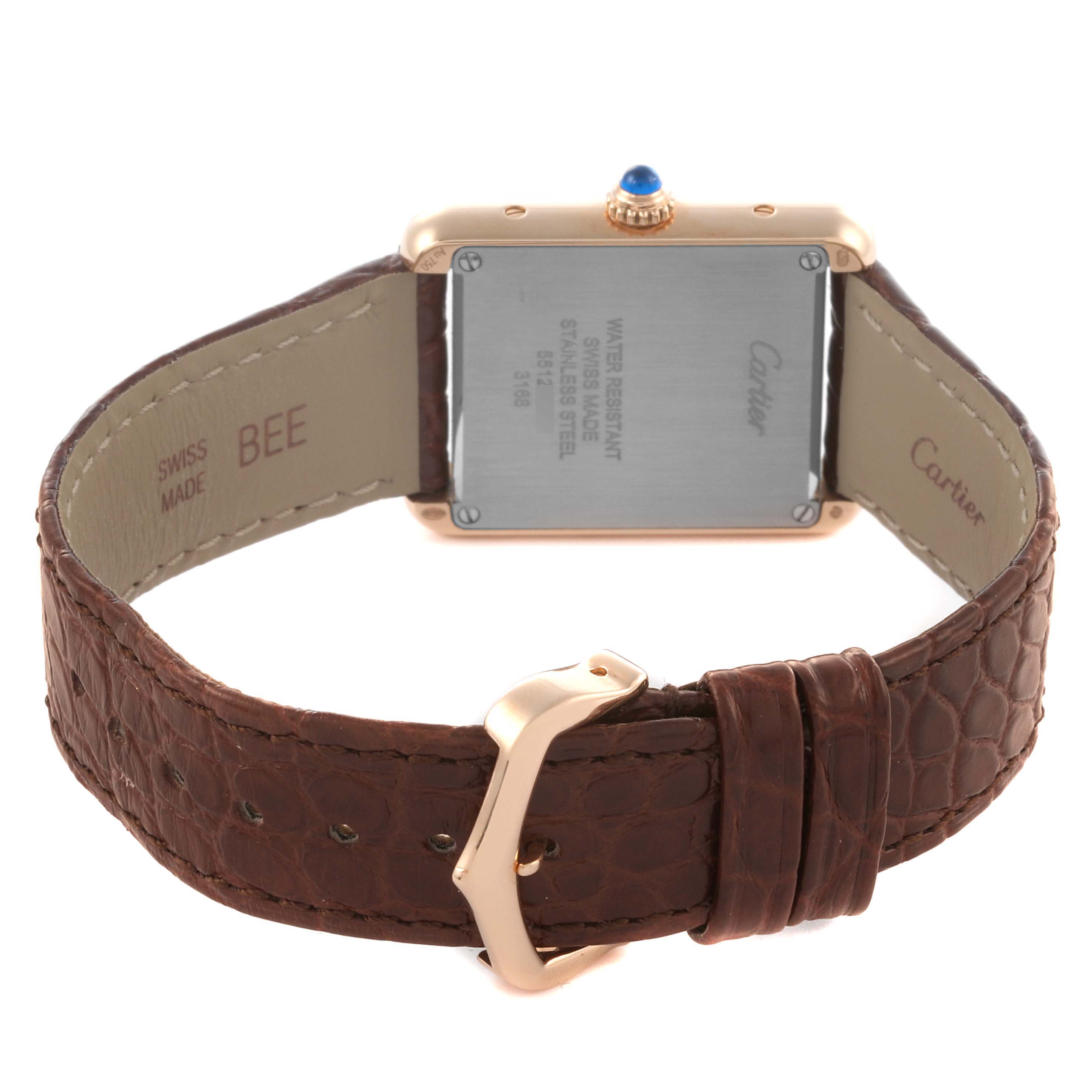 The image shows the back and side of a Cartier Tank Solo W5200024 Women's Steel and Gold (two tone) Silver Dial W5200024 Women's Steel and Gold (two tone) Silver Dial watch with a focus on the case back and leather strap.