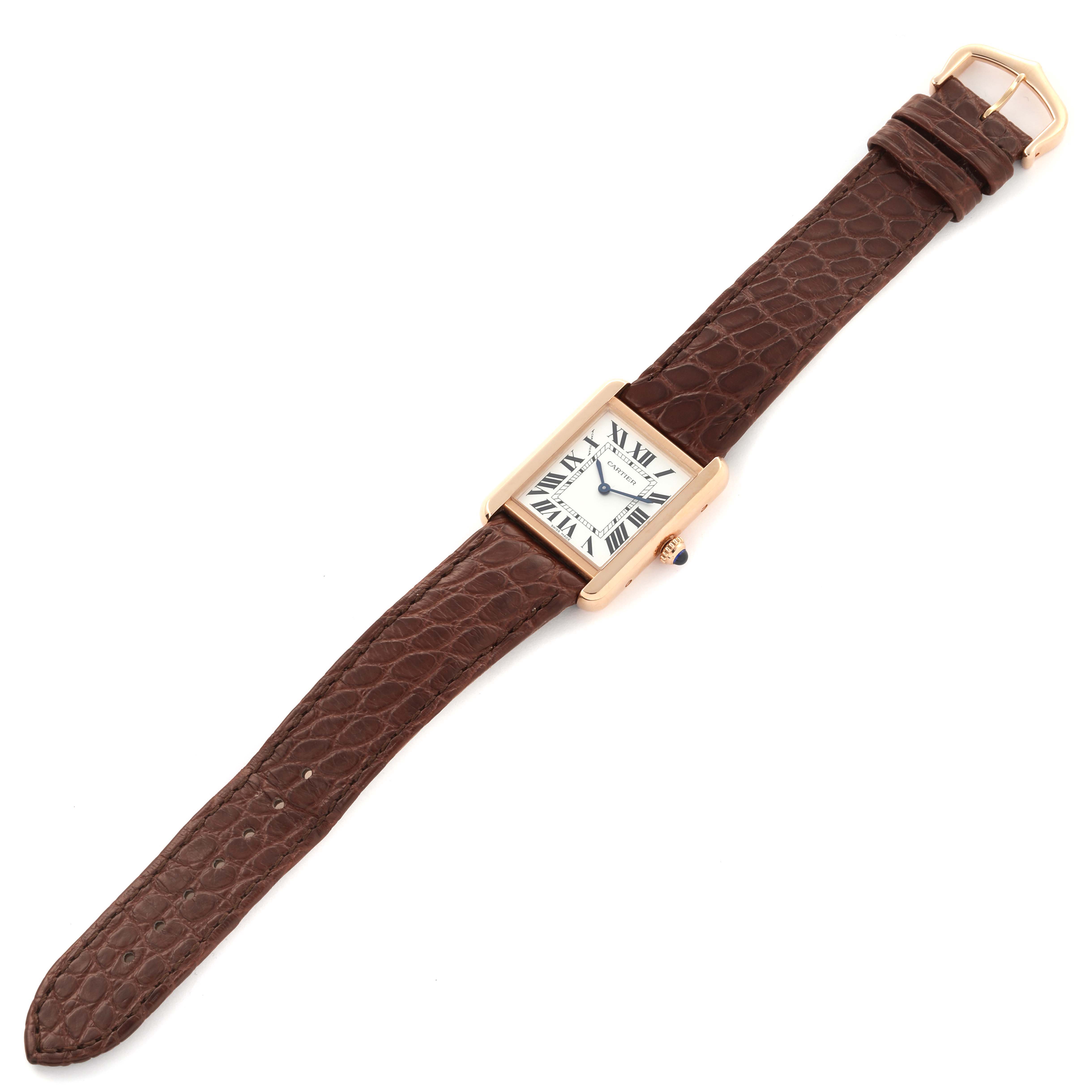 The Cartier Tank Solo W5200024 Women's Steel and Gold (two tone) Silver Dial W5200024 Women's Steel and Gold (two tone) Silver Dial watch is shown from a top view, displaying its rectangular face and brown leather strap.