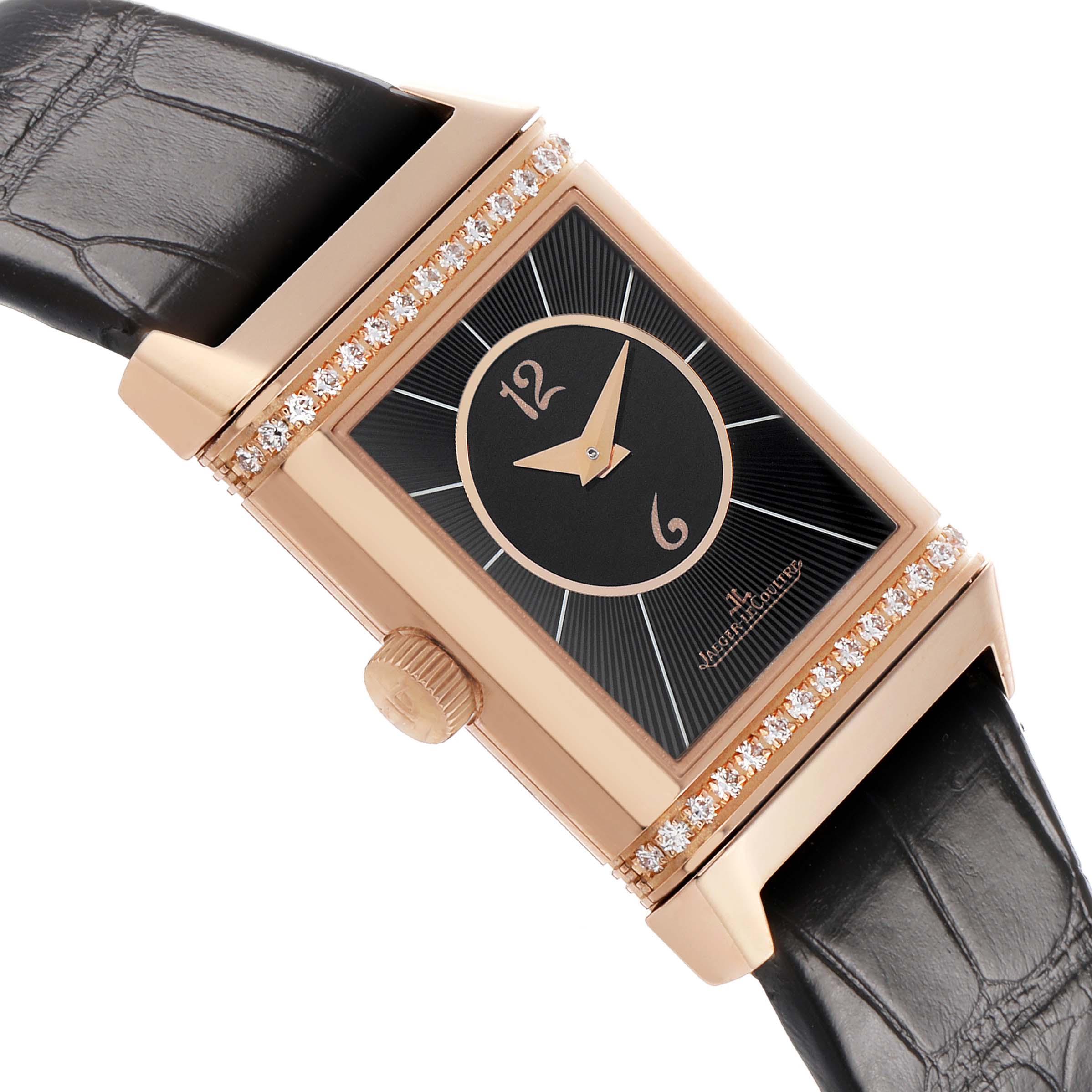 The Jaeger-LeCoultre Reverso watch is shown at an angle, highlighting the dial, bezel, crown, and leather strap.