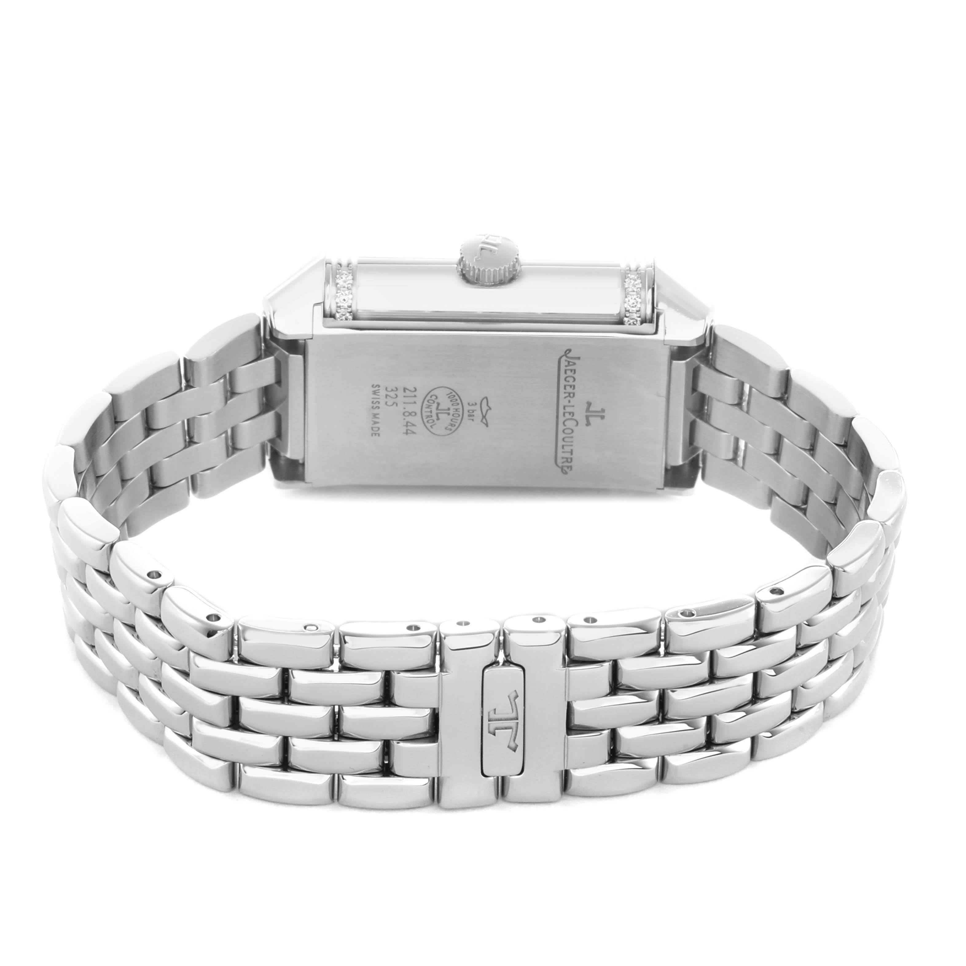 The image shows a Jaeger-LeCoultre Reverso watch from the back, highlighting the case, crown, and bracelet.